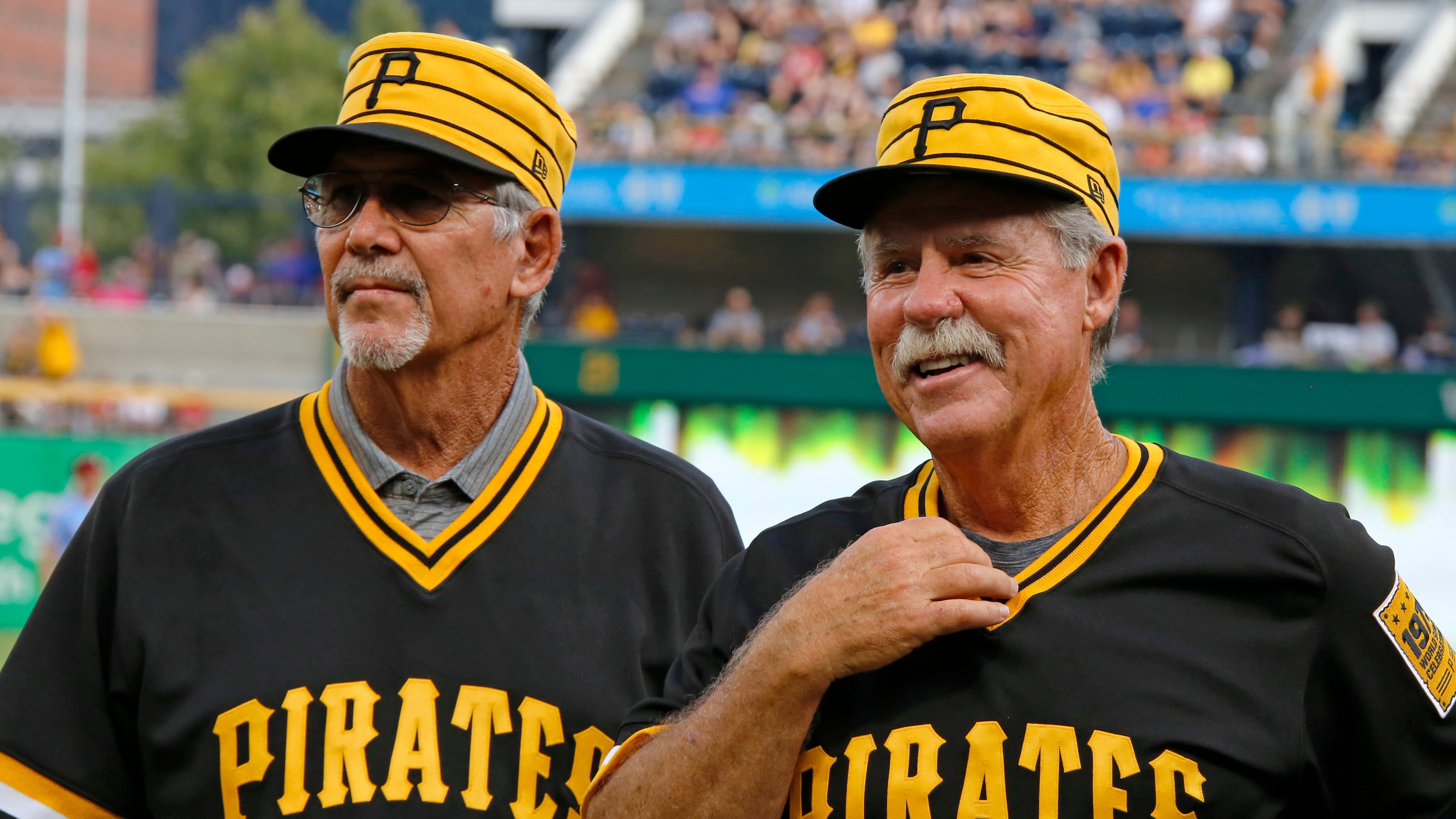 FILE - Tim Foli, left, and Phil Garner, the middle infield of the 1979 World Championship Pittsburgh Pirates team attend a pre-game ceremony remembering the team's accomplishment 40 years ago before a baseball game between the Pittsburgh Pirates and the Philadelphia Phillies in Pittsburgh, July 20, 2019. (AP Photo/Gene J. Puskar, File)