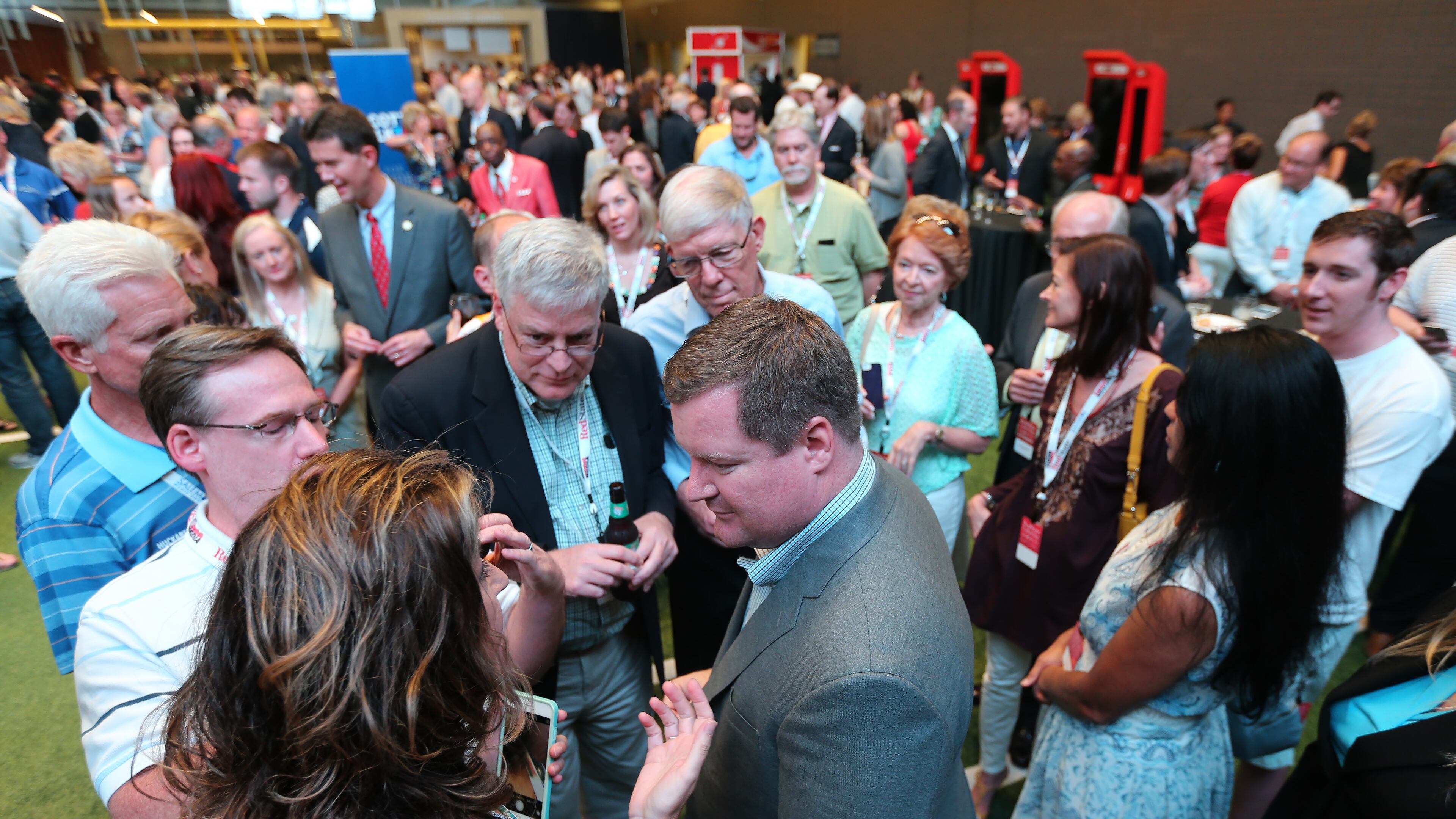 Erick Erickson, center, talks with fans after closing the RedState Gathering during a tailgate party at the College Football Hall of Fame on Saturday evening. This was the event that was supposed to feature Donald Trump. Ben Gray, bgray@ajc.com