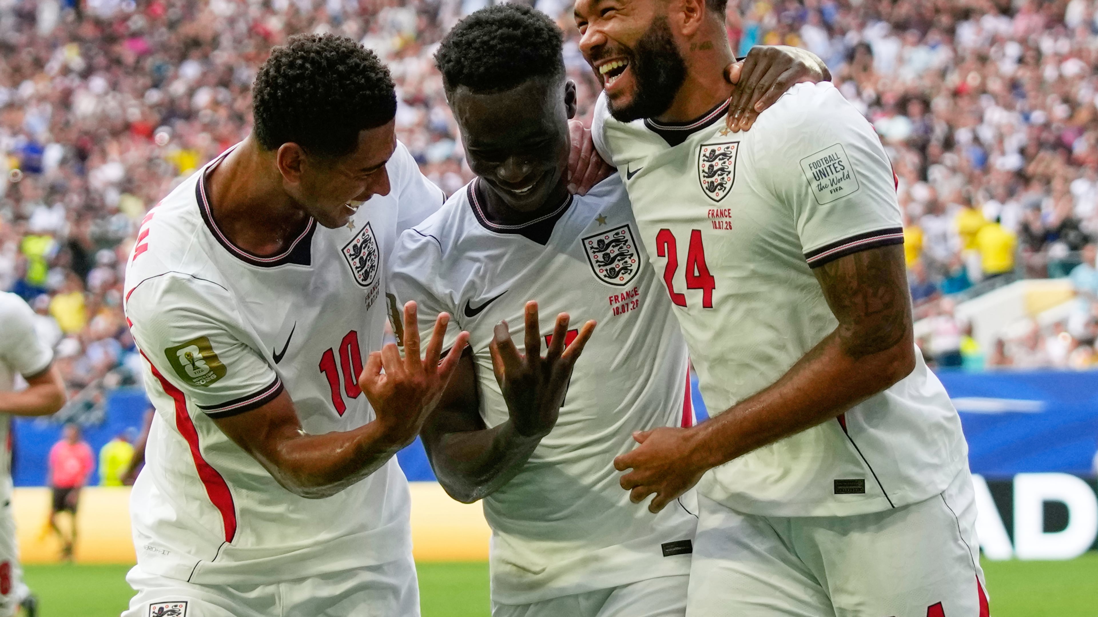 England's Bukayo Saka (7) is congratulated by Jude Bellingham (10) and Reece James (24) after scoring his side's 5th goal from the penalty spot during the World Cup third-place playoff soccer match between France and England in Miami Gardens, Fla., Saturday, July 18, 2026. (AP Photo/Lynne Sladky)