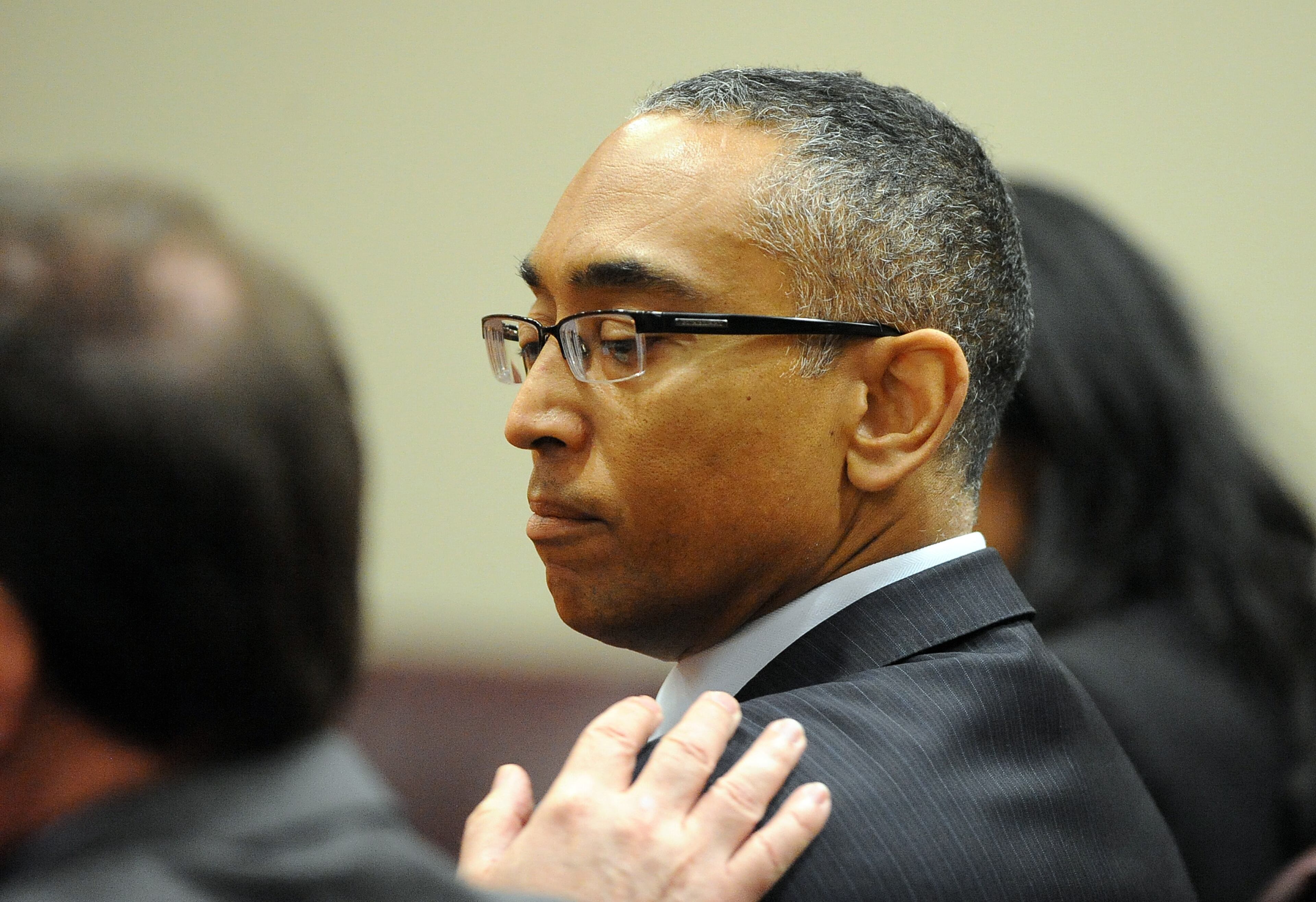 DeKalb CEO Burrell Ellis talks with his defense attorney Craig Gillen before the verdicts are read Wednesday. He was found guilty on 4 counts in his retrial before Superior Court Judge Courtney Johnson Wednesday, July 1, 2015.