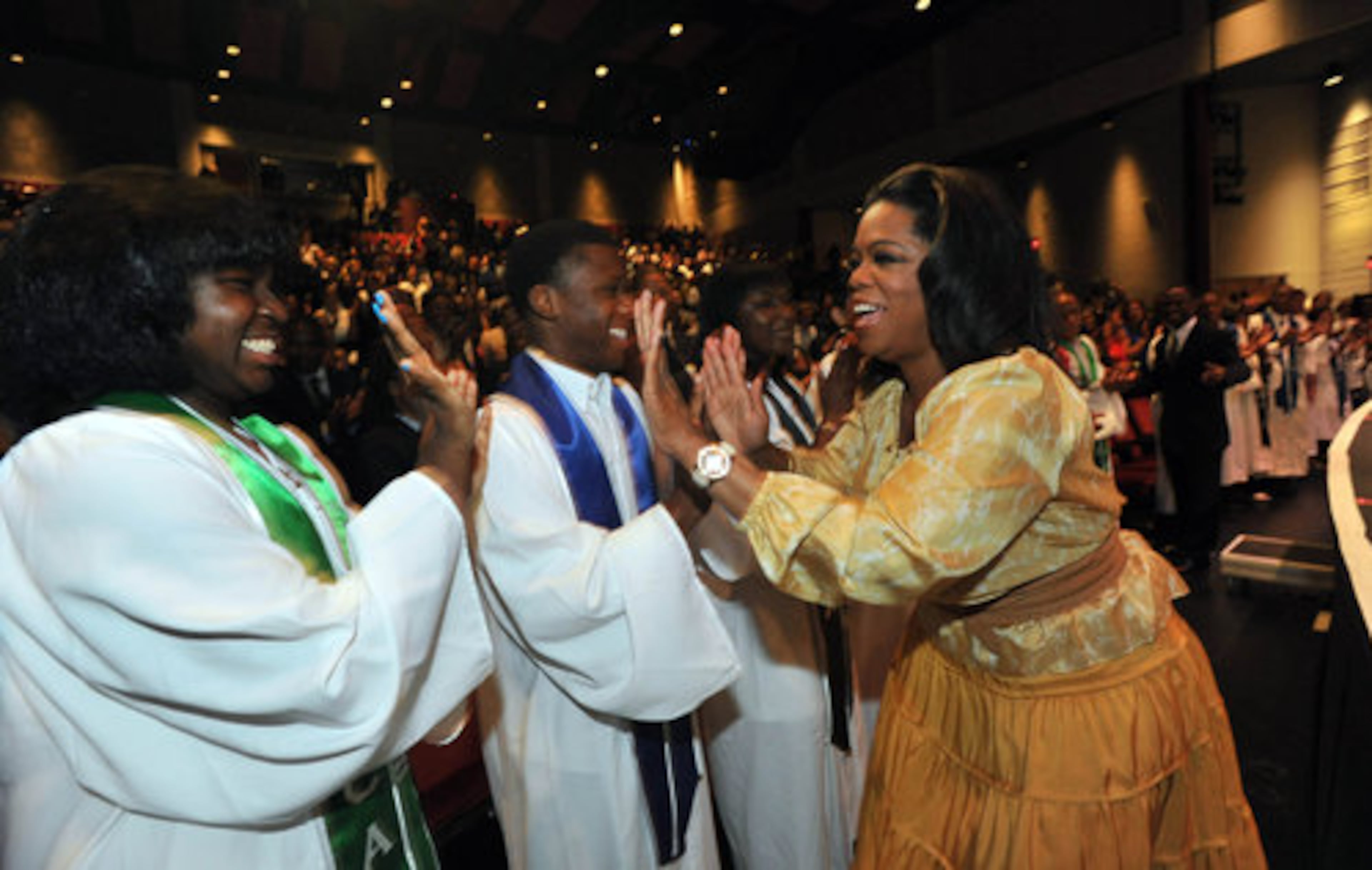 Chichi Ugwuh (left), 14, gets a high five from Oprah.