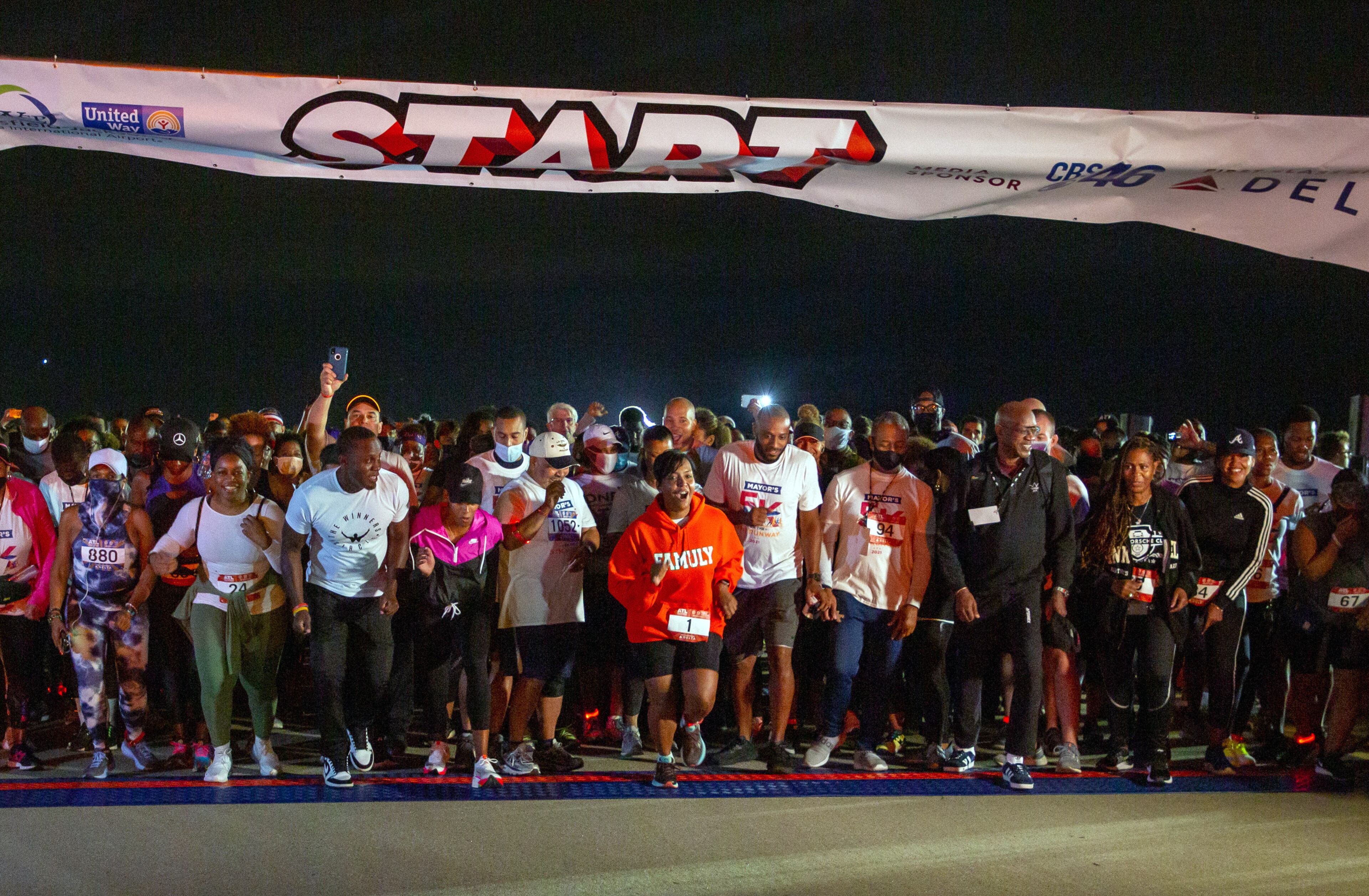 Mayor Keisha Lance Bottoms (center) leads the way at the start of the Mayor’s 5K on the 5th Runway at Hartsfield-Jackson International Airport on Saturday morning, October 16, 2021. (Photo: Steve Schaefer for The Atlanta Journal-Constitution)