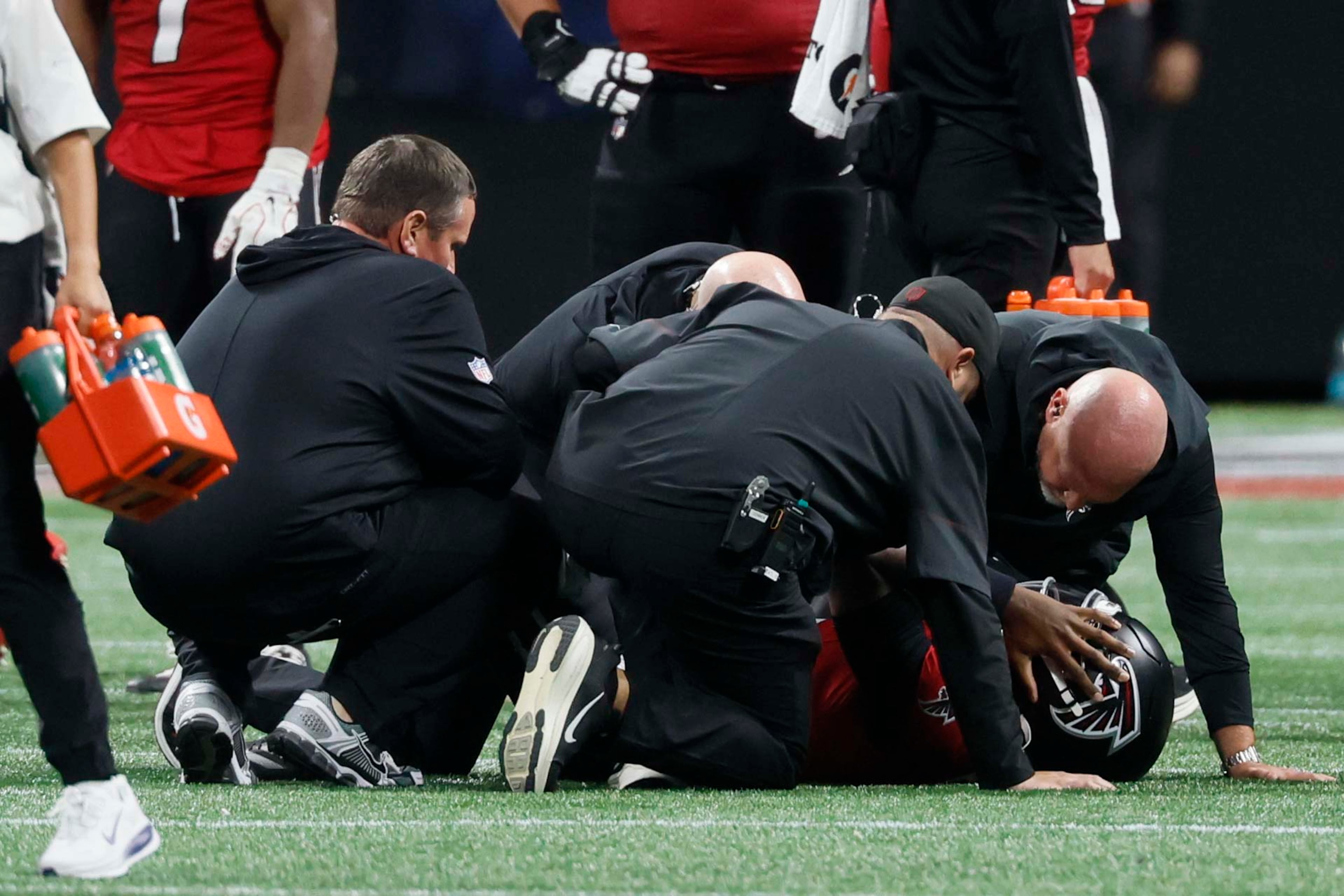 Atlanta Falcons quarterback Michael Penix Jr. receives assistance from his medical staff during the second half against the Baltimore Ravens on Sunday, Oct. 11, 2026. (Miguel Martinez/AJC)