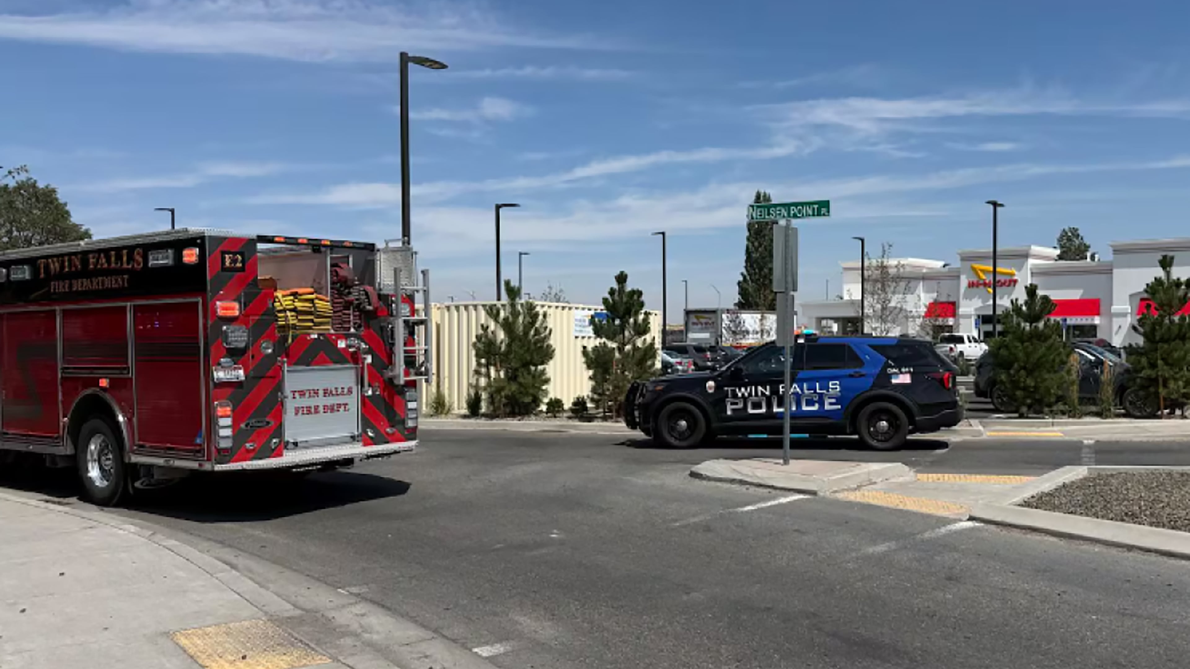 This image provided by KMVT shows the scene of a shooting that started at an In-N-Out Burger restaurant, Saturday, Aug. 1, 2026 in Twin Falls, Idaho. (KMVT via AP)