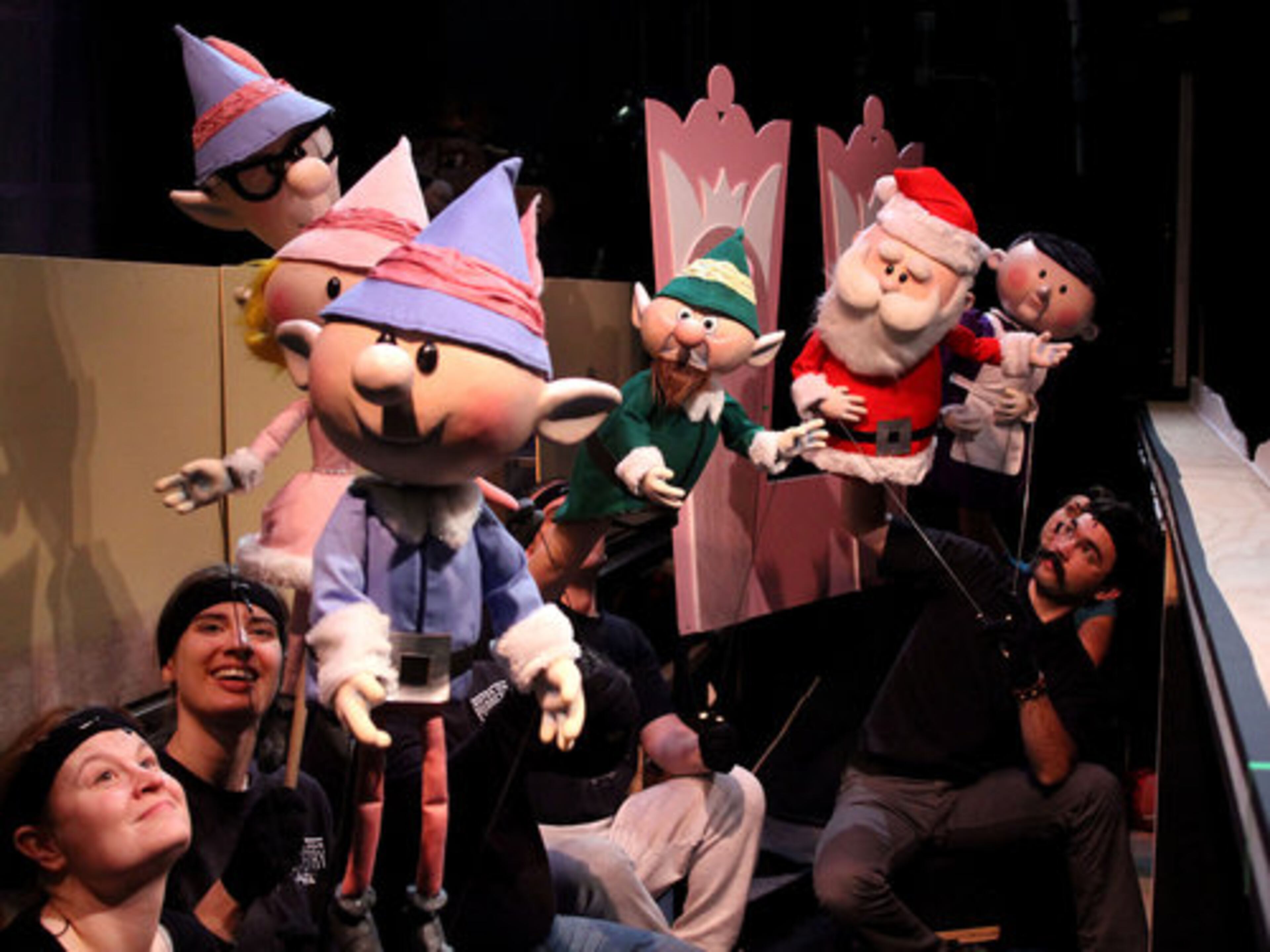 Puppeteers pose their characters for the camera during a break in rehearsals for the Center for Puppetry Arts' debut of their new production of "Rudolph the Red-nosed Reindeer."