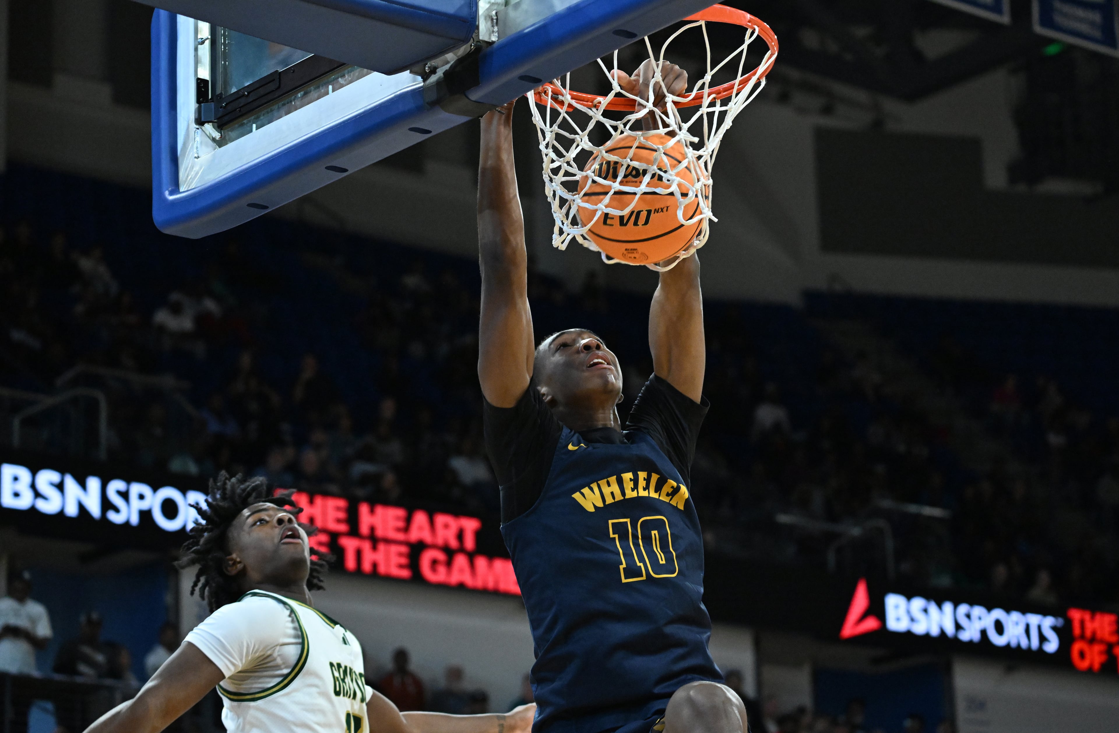 Wheeler's Tylis Jordan (10) dunks the ball during the second half of the GHSA Class 6A Boys State Basketball playoffs game at the Georgia State Convocation Center, Saturday, March 1, 2025, in Atlanta. Wheeler won 68-53 over Grayson. (Hyosub Shin / AJC)