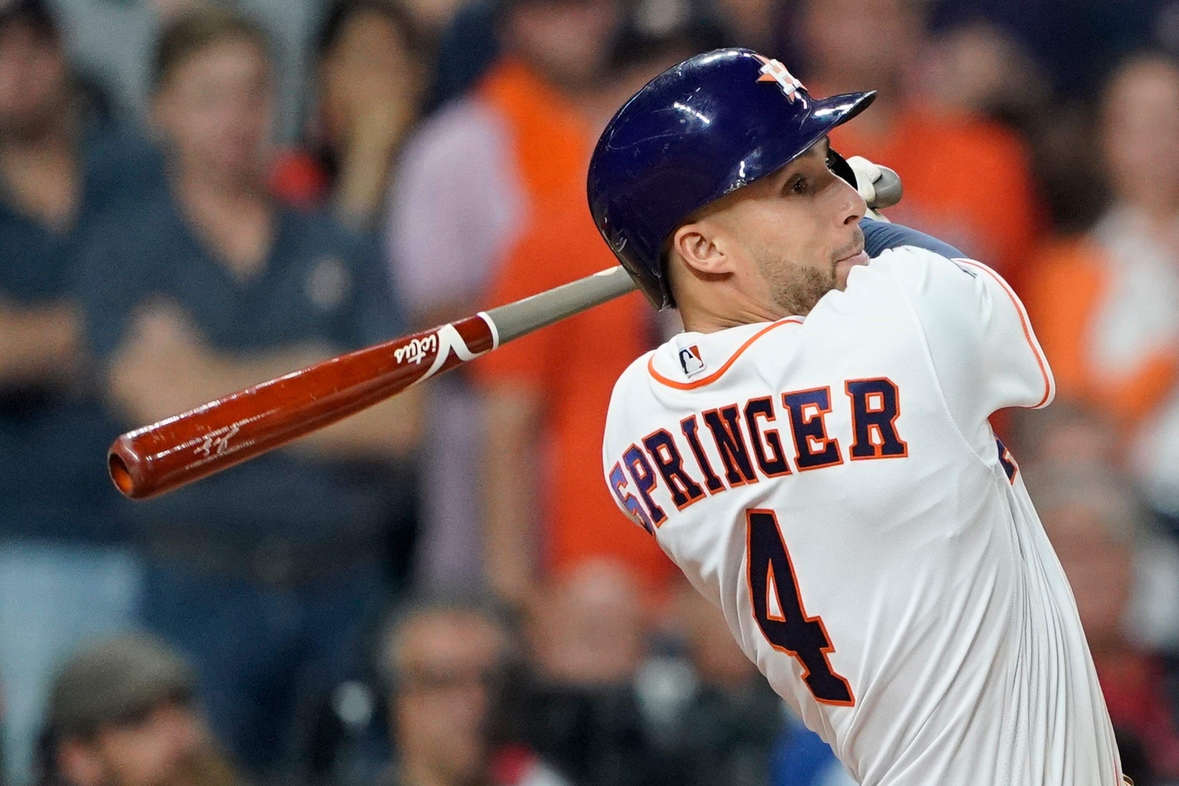 Houston Astros' George Springer hits an RBI double during the eighth inning of Game 1 of the baseball World Series against the Washington Nationals Tuesday, Oct. 22, 2019, in Houston. (AP Photo/David J. Phillip)