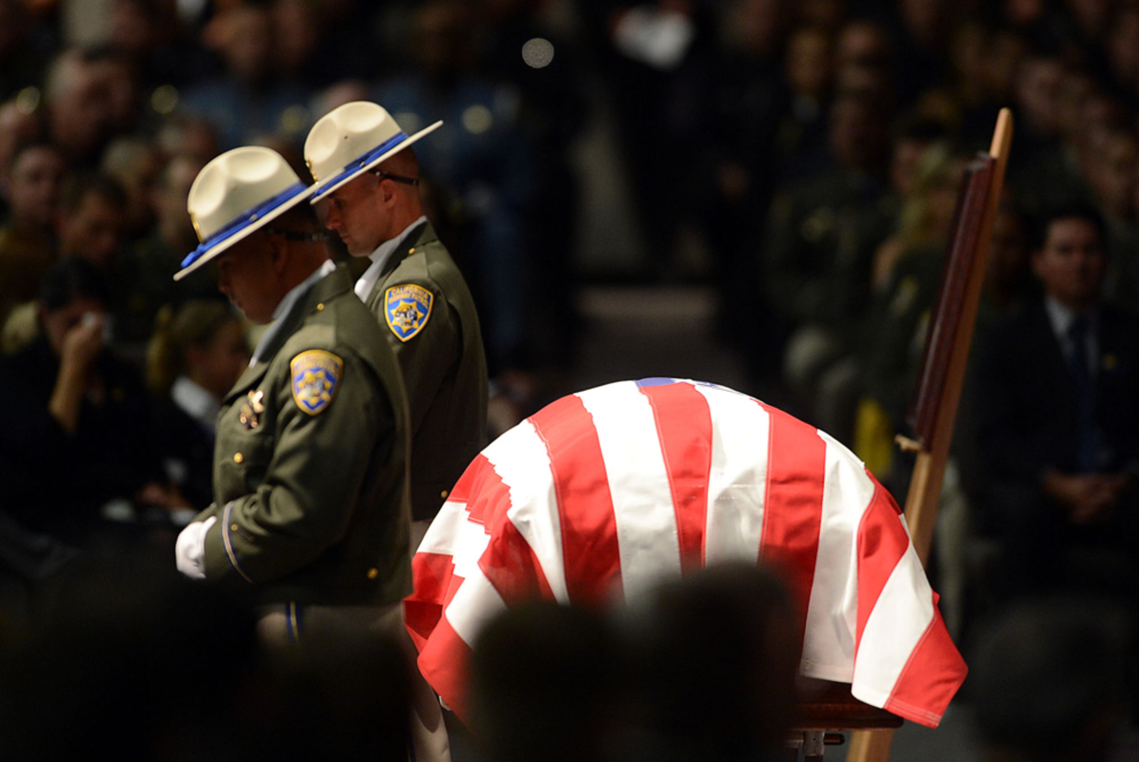 HONORING A FALLEN BROTHER--The body of California Highway Patrol Officer Kenyon Youngtrom rests in the Mission church in Vacaville, Calif., on Thursday morning, Sept. 13, 2012. Youngstrom was killed in the line of duty last week in Walnut Creek, Calif.