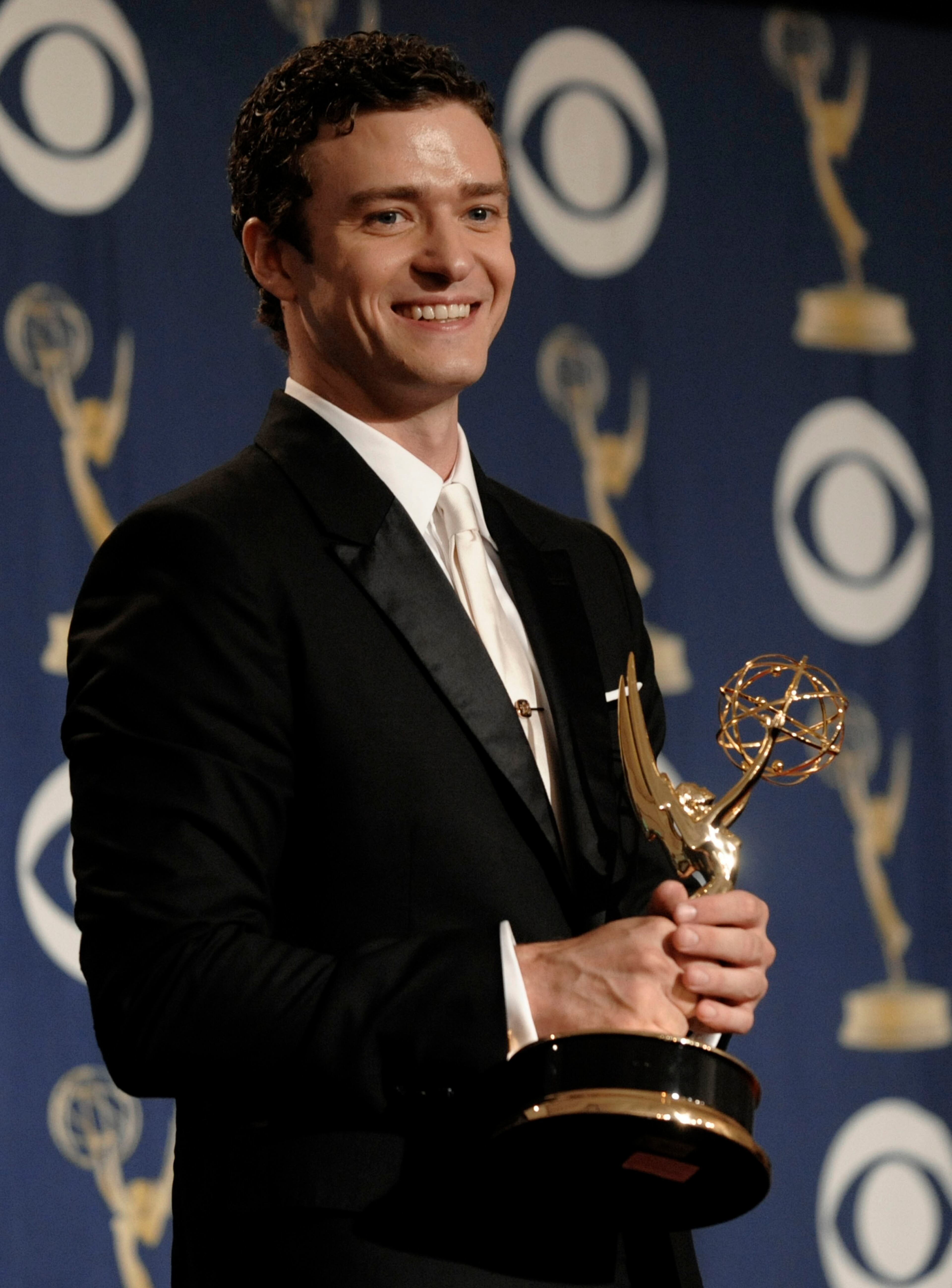 Justin Timberlake, who appeared on the TV show "Saturday Night Live," holds the best guest actor award for a comedy series backstage at the 61st Primetime Emmy Awards on Sunday, Sept. 20, 2009, in Los Angeles.