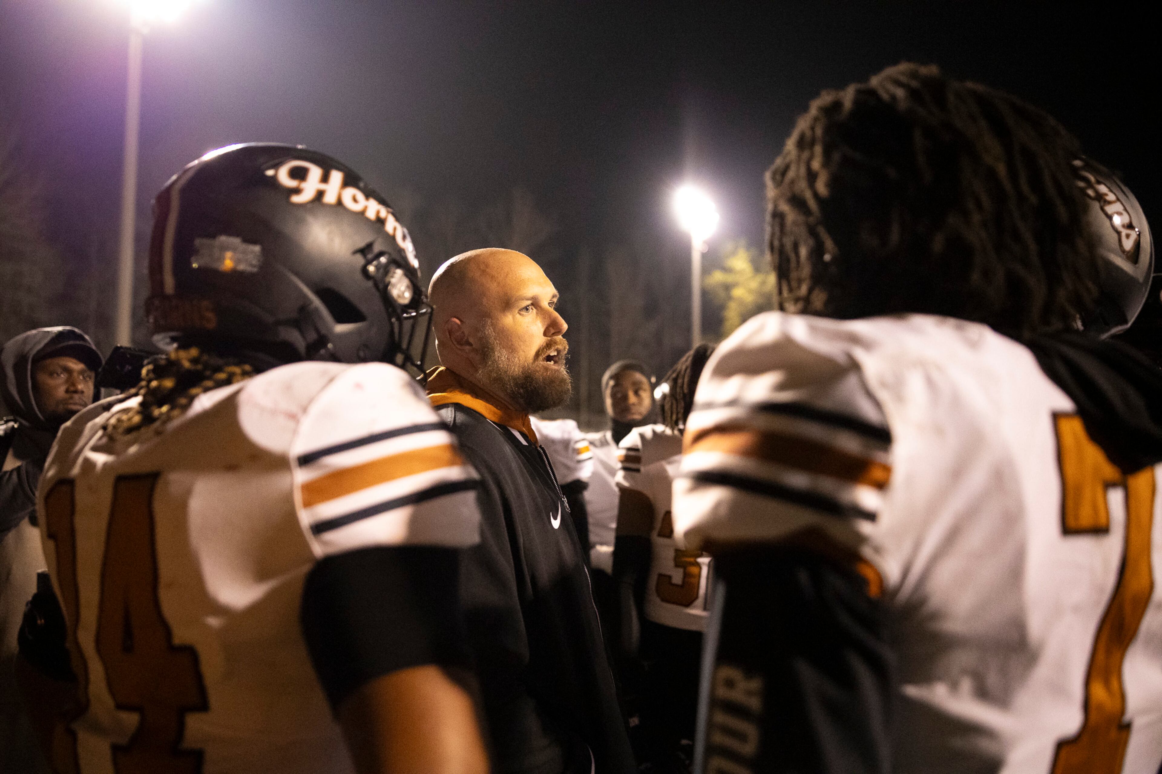 Kell head coach Bobby May speaks to his players after a hard-fought loss during their Class 4A semifinal against Creekside on Friday, Dec. 5, 2025, at Creekside High School in Fairburn. (Oscar Guevara Saenz for the AJC)