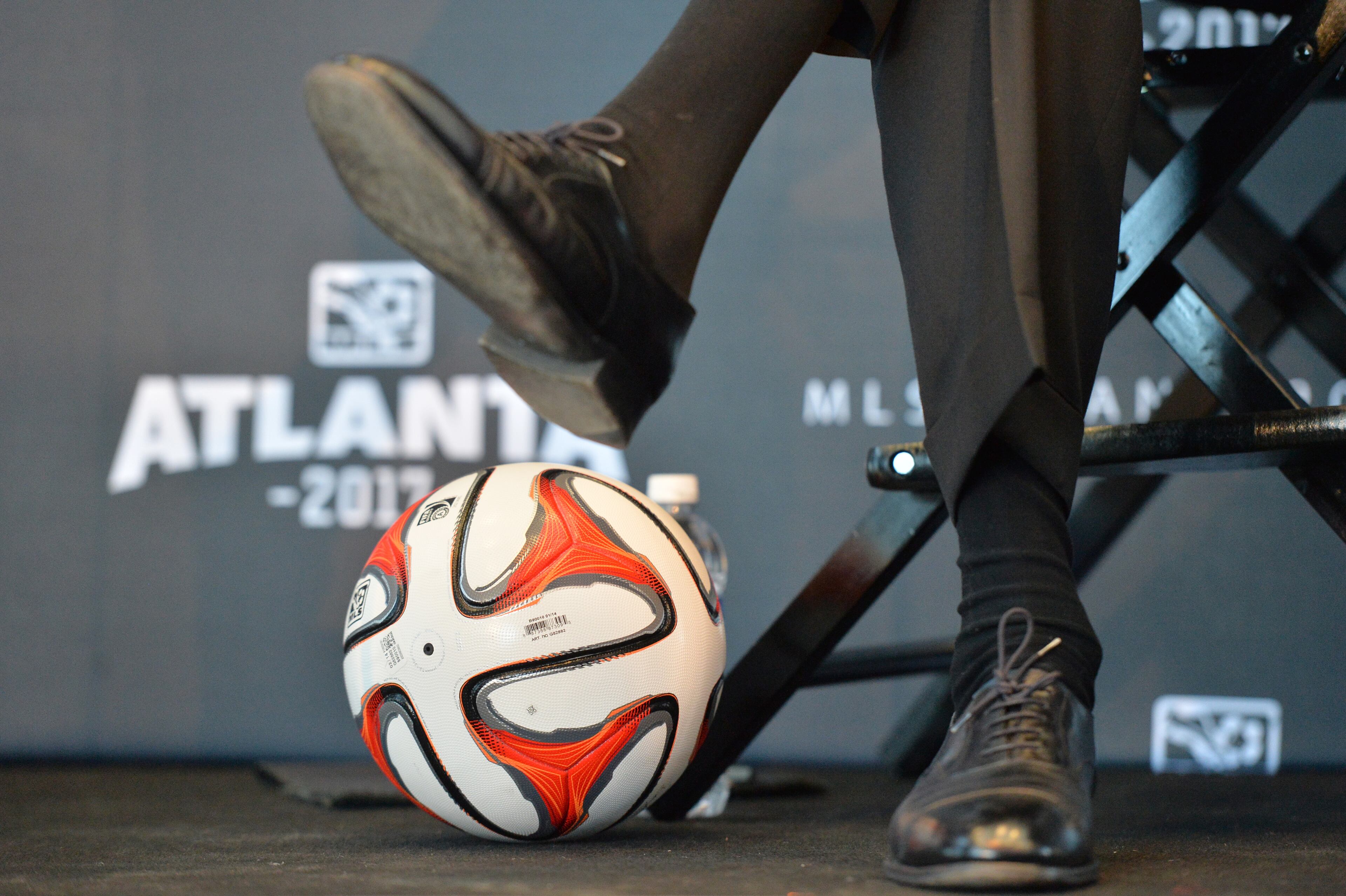Falcons owner Arthur Blank sits next to a soccer ball during the official announcement event in downtown Atlanta on Wednesday, April 16, 2014. MLS commissioner Don Garber, Falcons owner Arthur Blank, Mayor Kasim Reed, executive director of GWCC Frank Poe and others officially announced that Atlanta will be the 22nd team in MLS on Wednesday downtown amidst a parade-like atmosphere. HYOSUB SHIN / HSHIN@AJC.COM