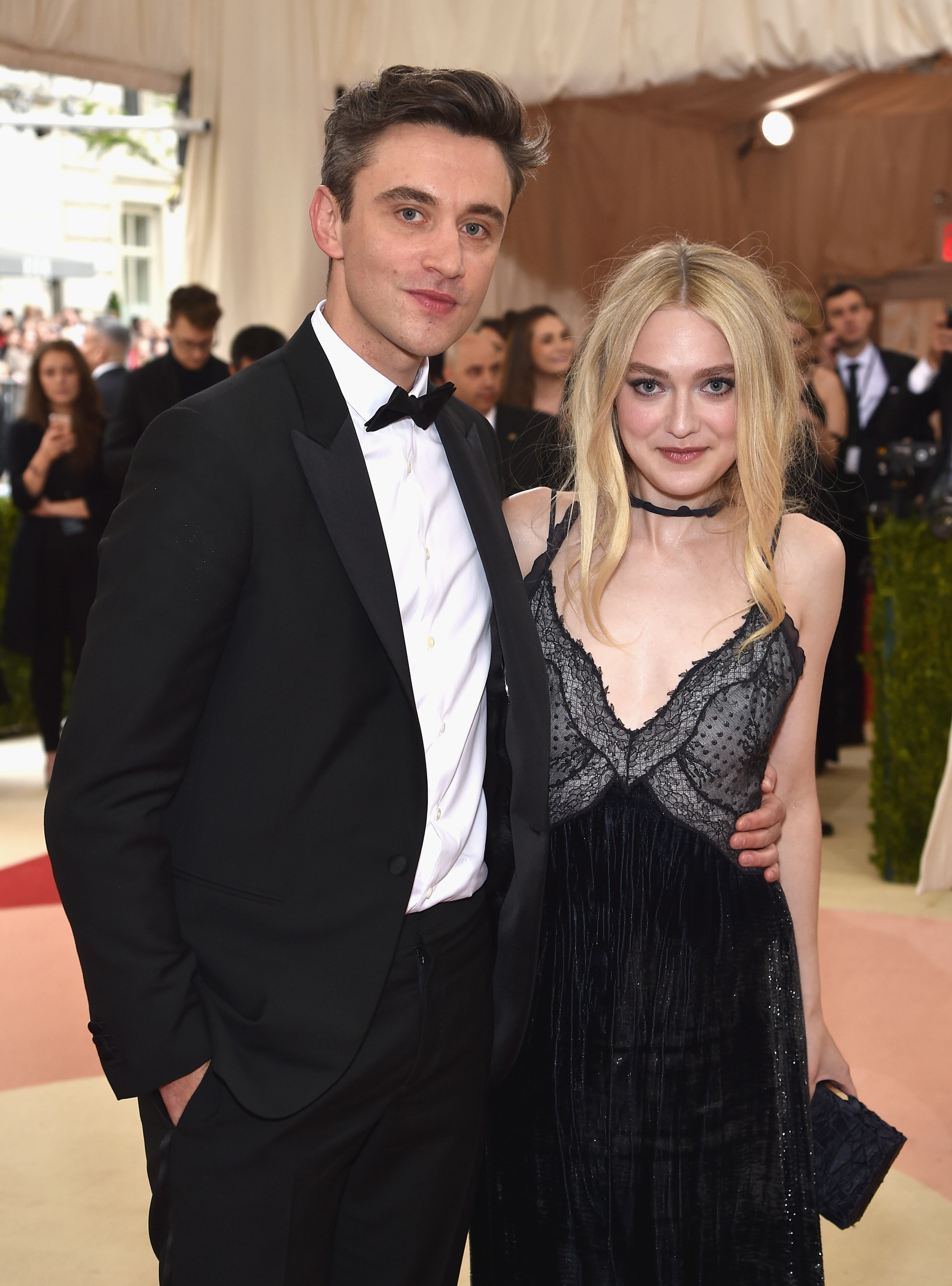 Guillaume Henry (L) and Dakota Fanning attend the "Manus x Machina: Fashion In An Age Of Technology" Costume Institute Gala at Metropolitan Museum of Art on May 2, 2016 in New York City. (Photo by Dimitrios Kambouris/Getty Images)