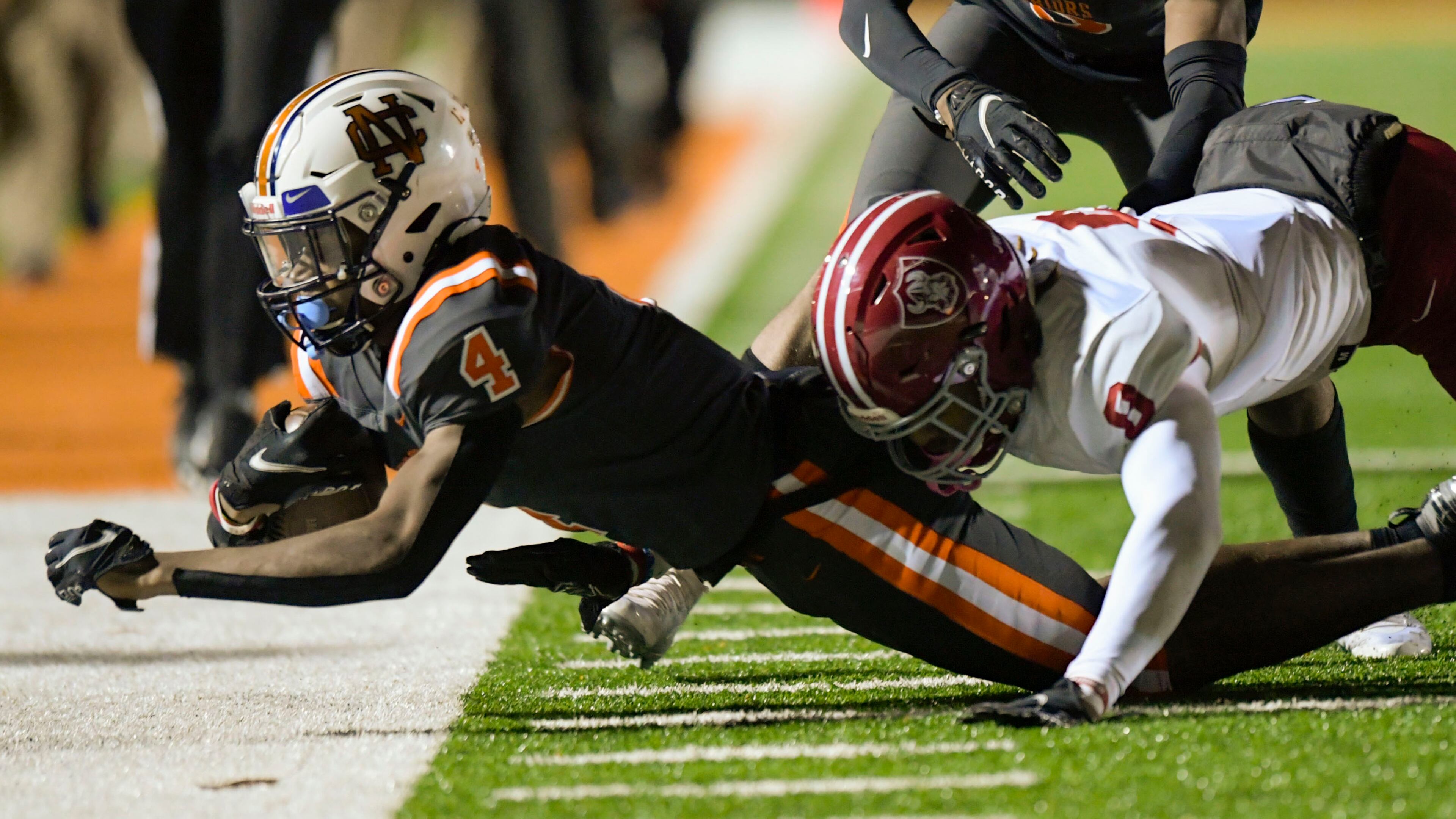 North Cobb wide receiver Xavier Clark (4) is forced out of bounds by Lowndes free safety Tj Quinn (8) during Friday's state playoff game in Kennesaw. Lowndes advanced in the Class 7A playoffs with a 21-13 victory over North Cobb.