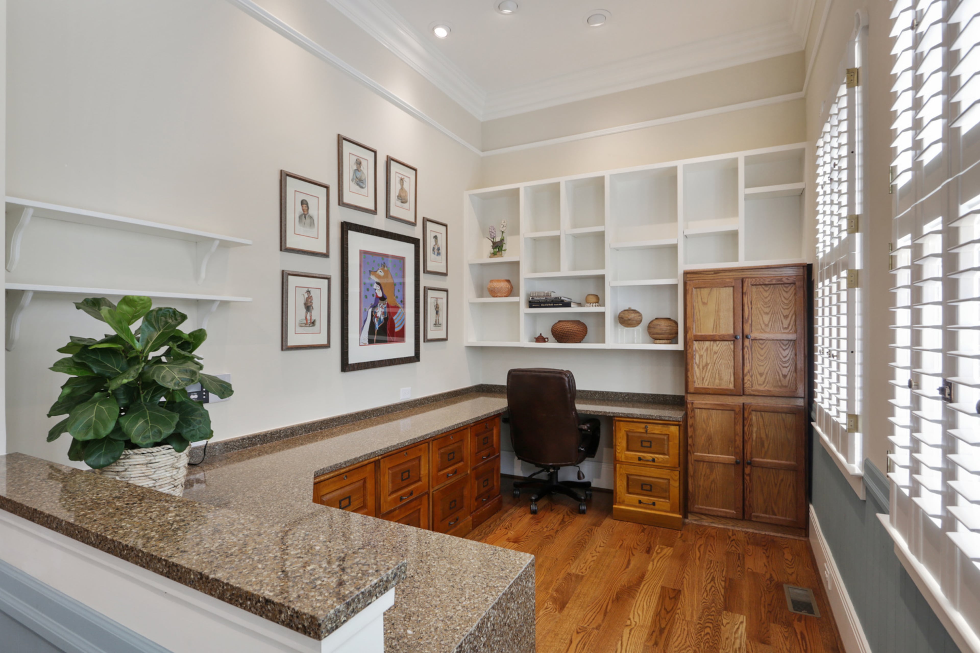 The double office seamlessly flows off of the den, with plenty of room for two people to work or two to do schoolwork. It also is a great place for displaying artwork or other interesting objects. Text by Jill Huitron