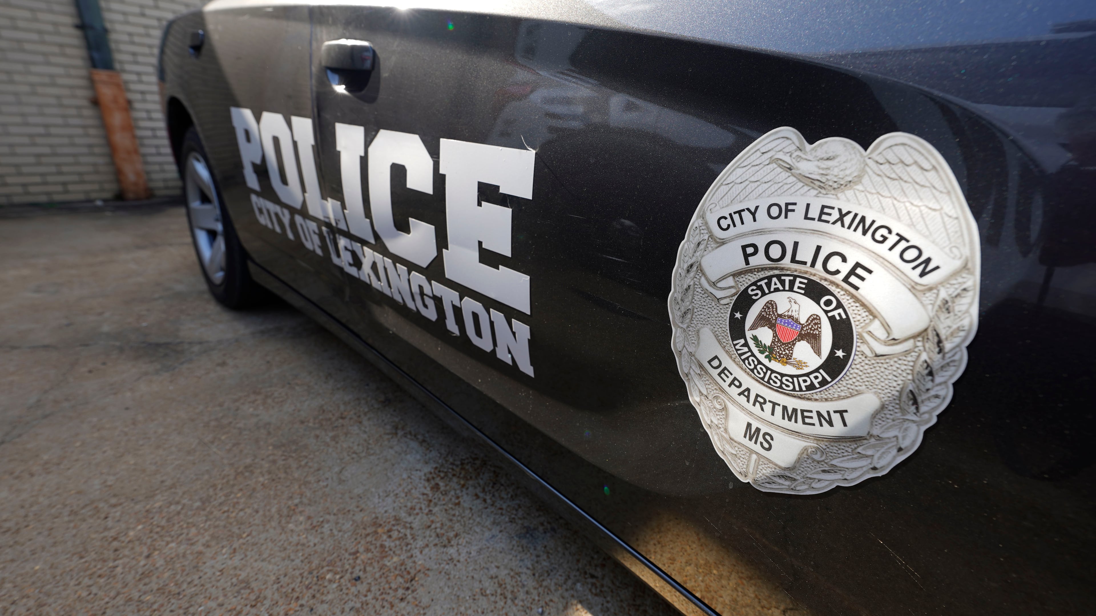 FILE - A Lexington, Miss., police cruiser is parked outside their facility near the town square, Monday, Aug. 15, 2022. The Lexington police department unconstitutionally jailed people for unpaid fines without first assessing whether they could afford to pay them, the U.S. Department of Justice said Thursday, Feb. 29, 2024. (AP Photo/Rogelio V. Solis, File)