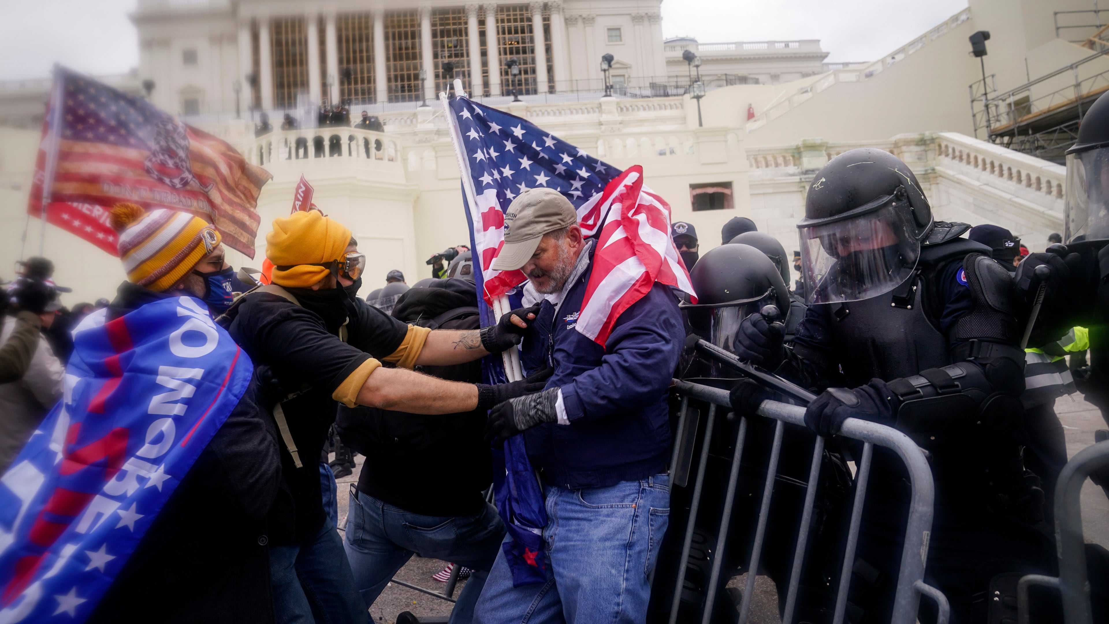 FILE - Rioters try to break through a police barrier at the Capitol on Jan. 6, 2021, in Washington. (AP Photo/John Minchillo, File)