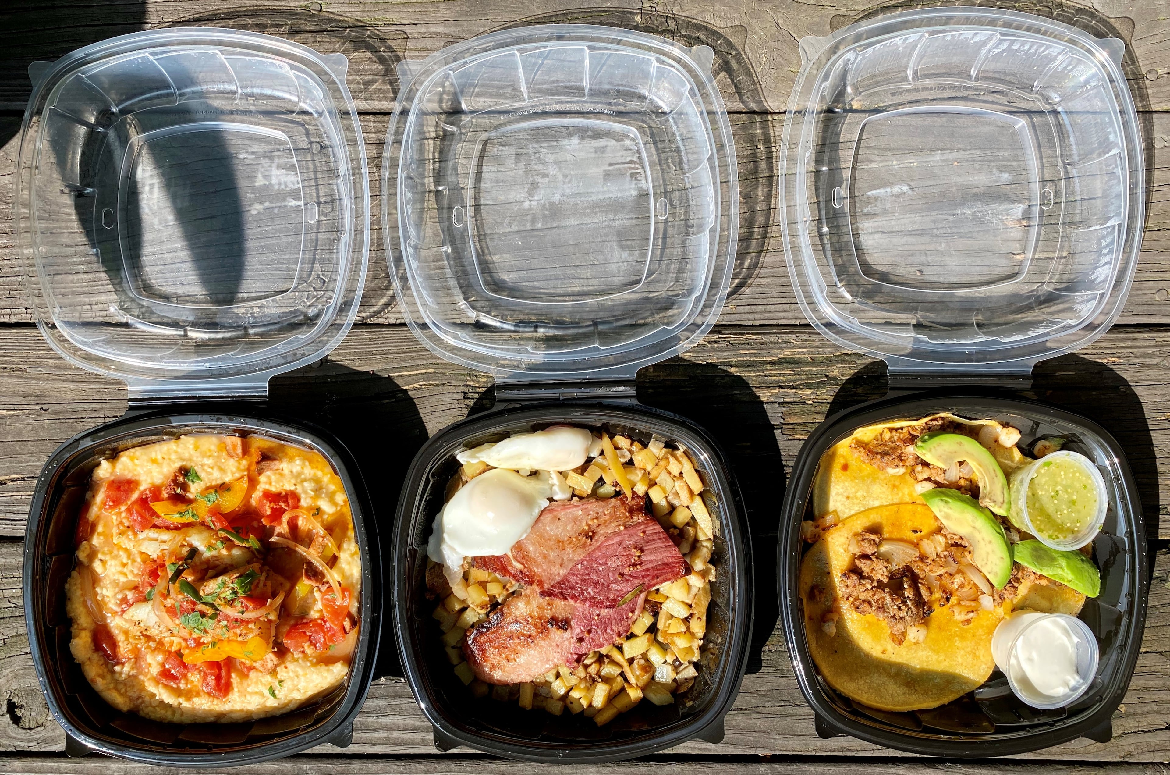 Takeout from Hot Betty’s in Tucker: Fish and grits, corned beef brisket hash with poached eggs and breakfast tacos with chorizo, onion and hominy.
Wendell Brock for The Atlanta Journal-Constitution