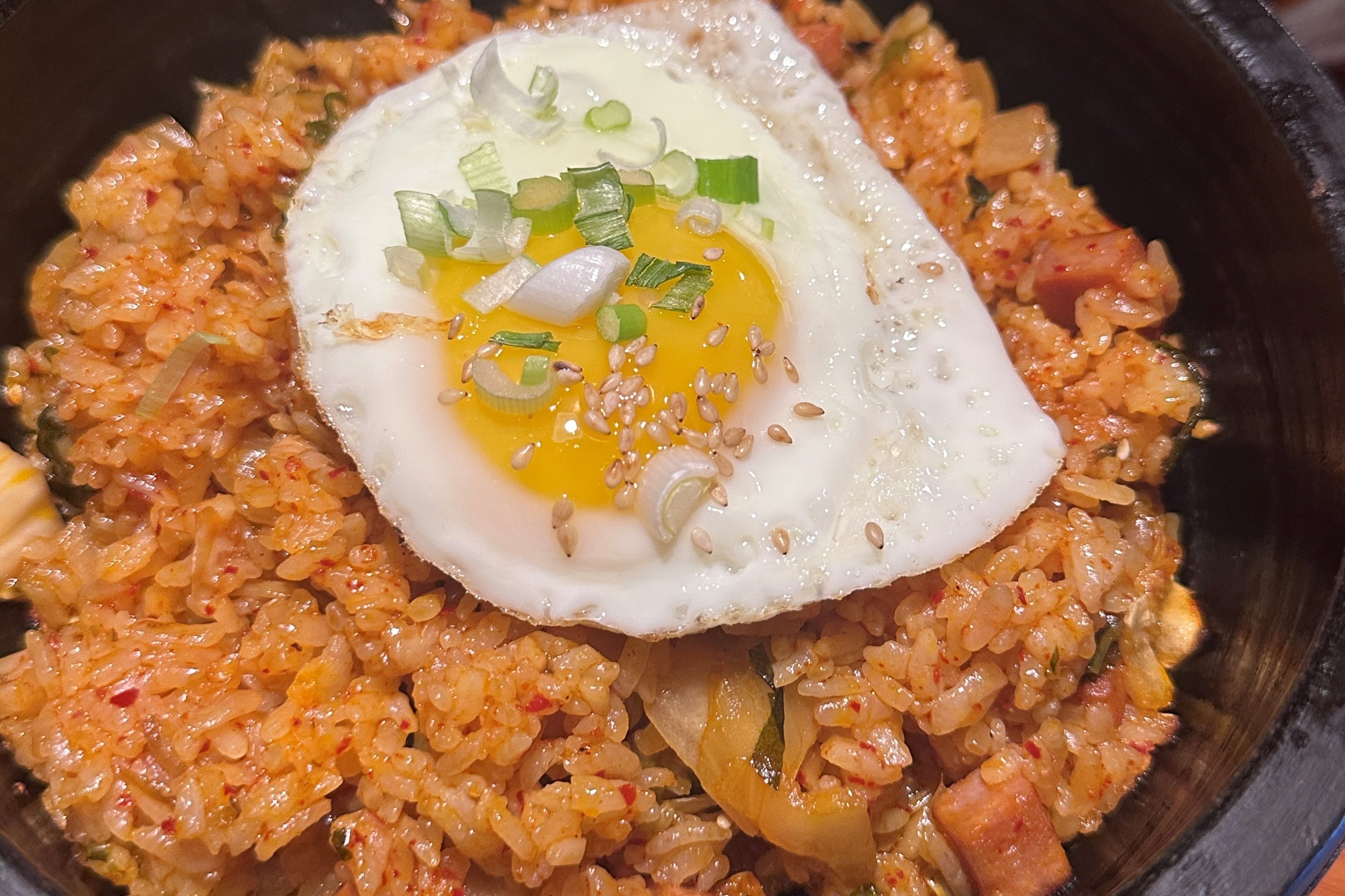 The kimchi fried rice with Spam at Tofu Kitchen in Johns Creek delivers deep flavor in every bite. (Lia Picard for the AJC)