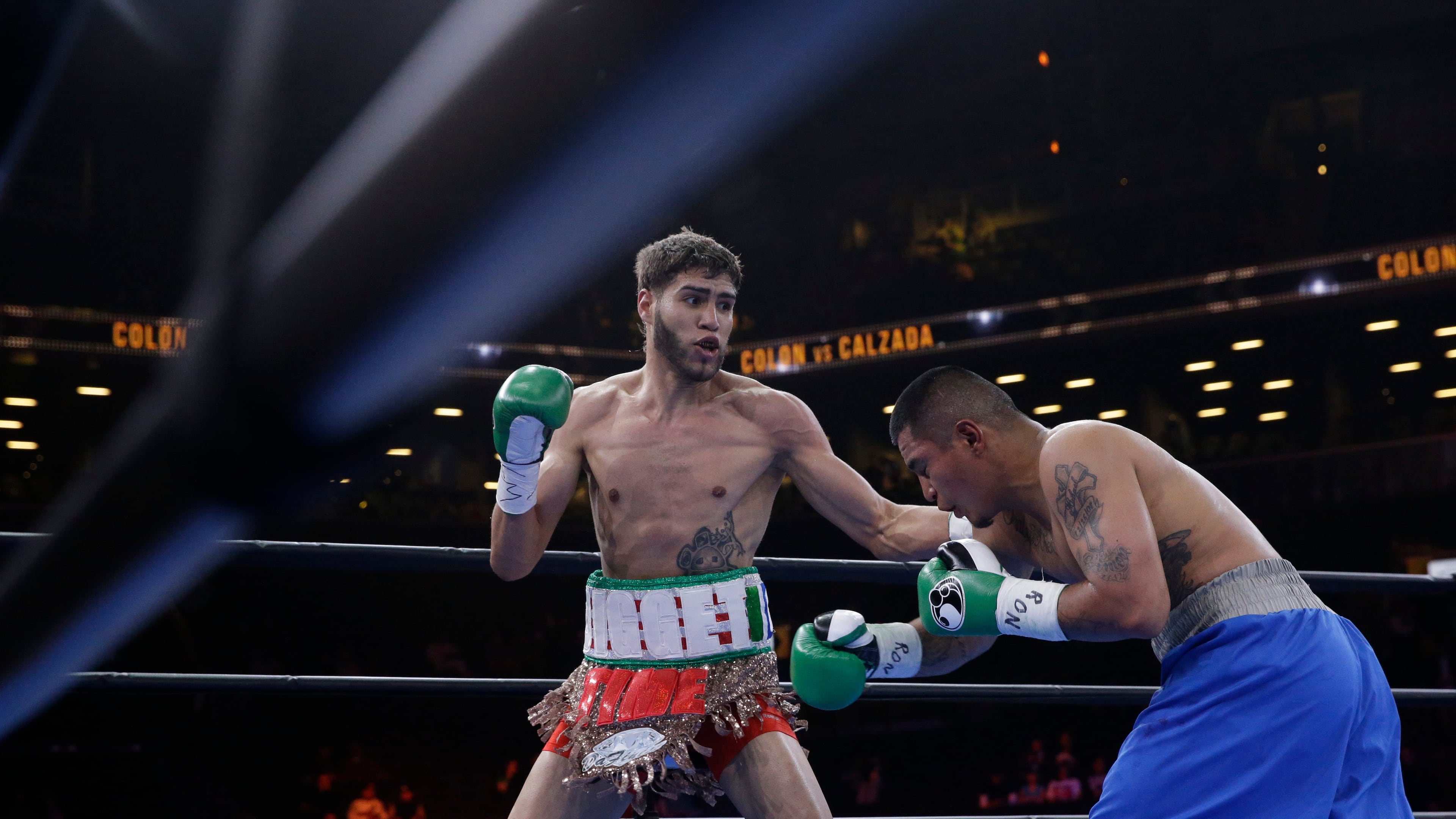 FILE - Prichard Colon, left, exchanges punches with Daniel Calzada during a junior middleweight title boxing match, Saturday, April 11, 2015, at New York. Colon won by TKO. (AP Photo/Mary Altaffer, file)