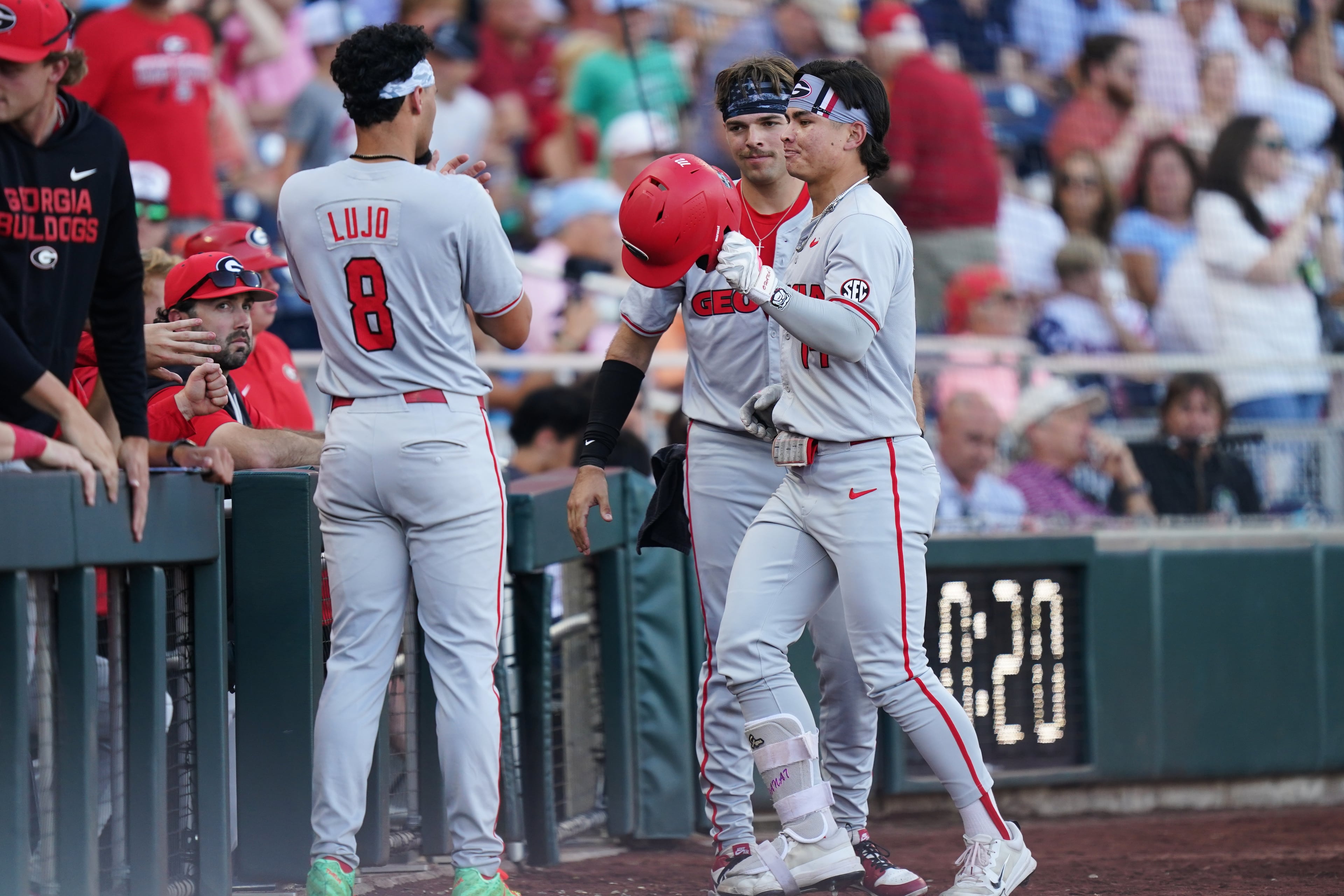 Georgia’s Kenny Ishikawa (right) is congratulated by teammates after hitting a homer during their College World Series game against Oklahoma on Monday, June 15, 2026, in Omaha, Neb. (Vera Nieuwenhuis/AP)