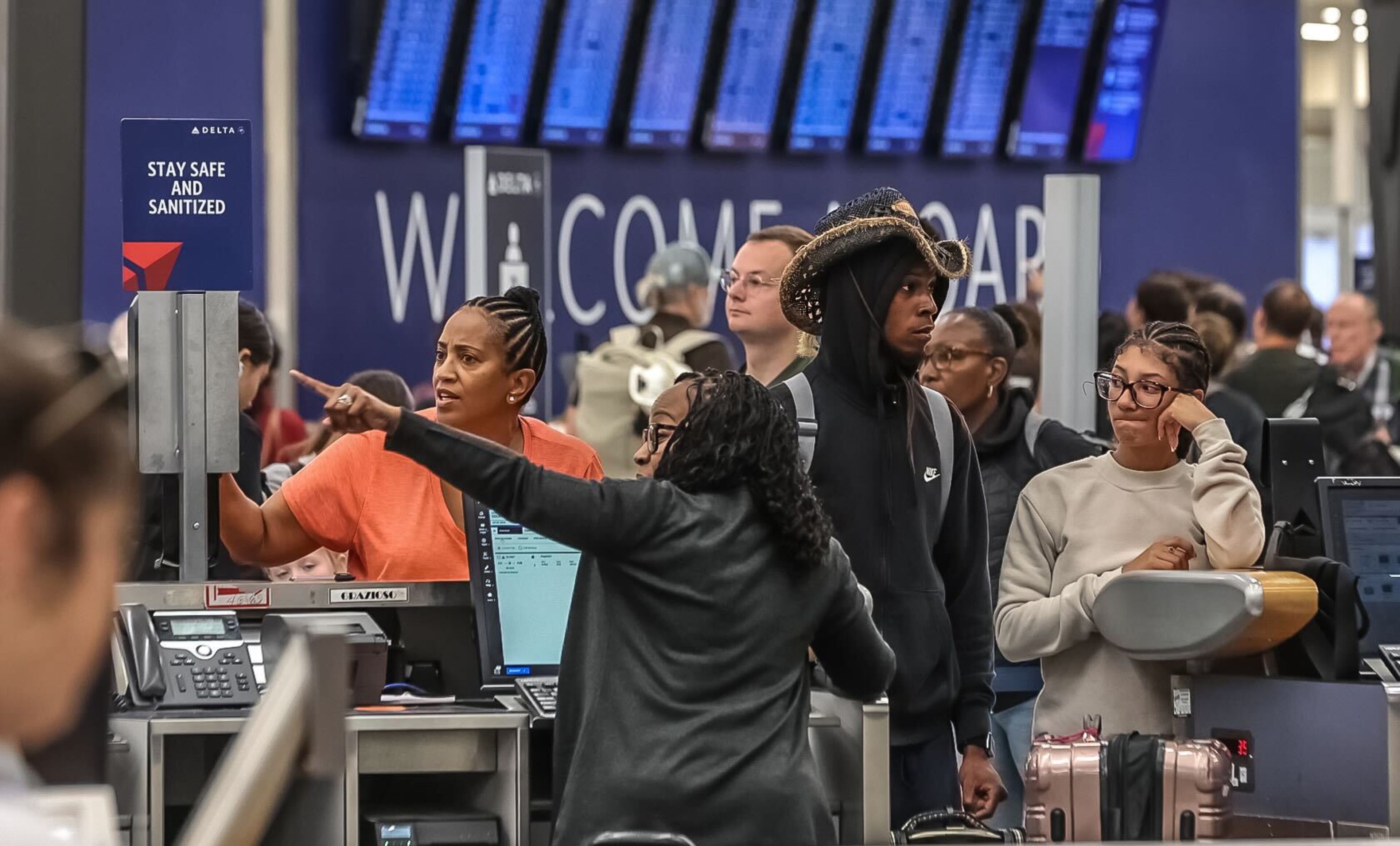 Travelers have been sleeping at the Atlanta airport and stranded at airports around the world since the meltdown began Friday with a technology outage that affected many Microsoft users.