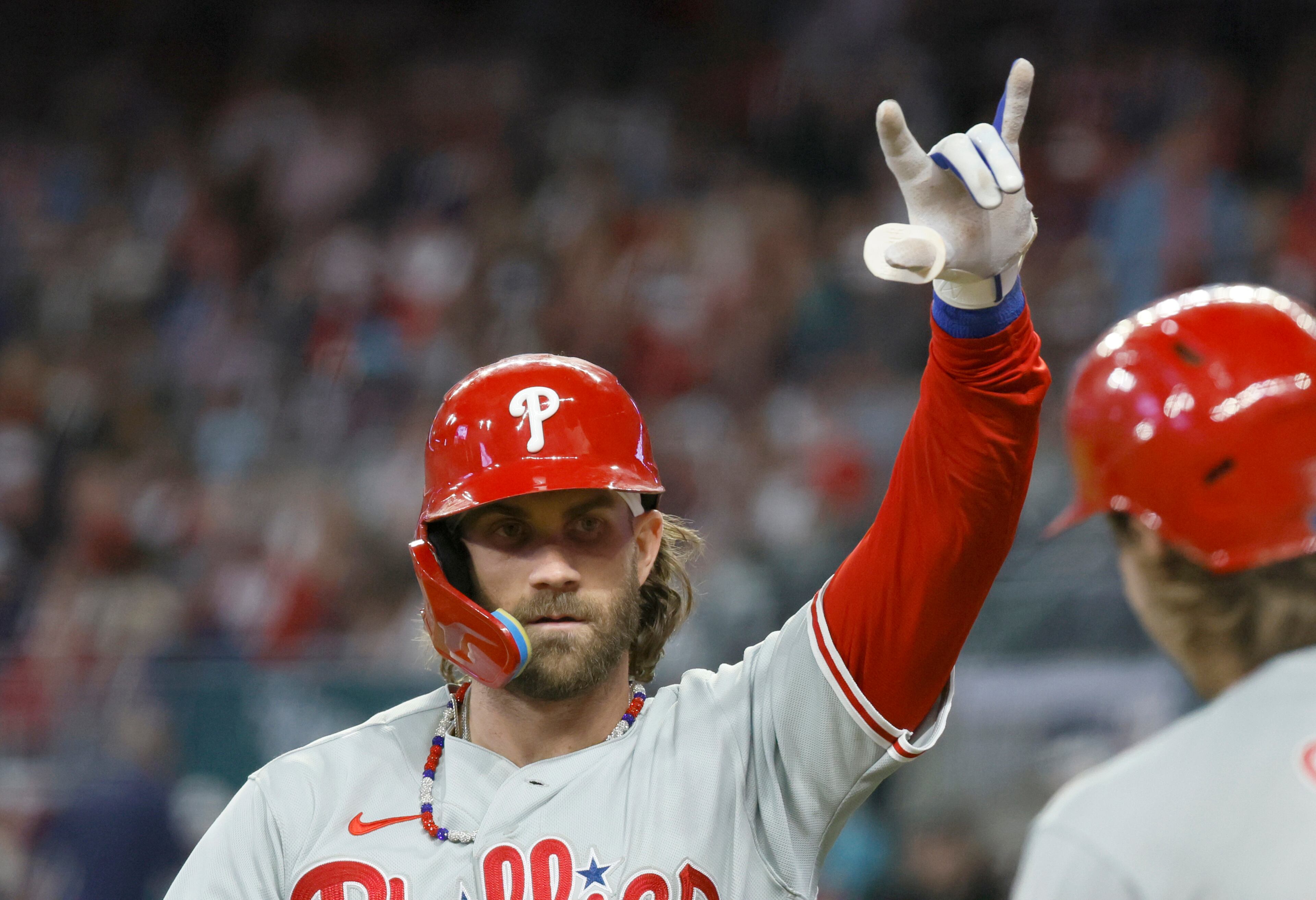 Philadelphia Phillies designated hitter Bryce Harper celebrates his home run in the 6th inning during Game 1 of the NLDS at Truist Park in Atlanta on Saturday, Oct. 7, 2023. (Miguel Martinez / Miguel.Martinezjimenez@ajc.com)