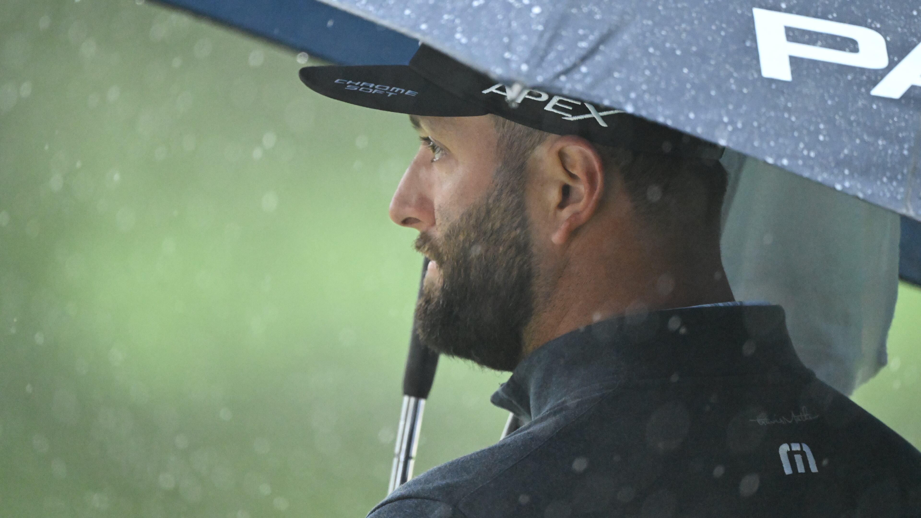 Jon Rahm waits for crew to clean water off of seventh hole during third round of the 2023 Masters Tournament at Augusta National Golf Club, Saturday, April 8, 2023, in Augusta, Ga. (Hyosub Shin / Hyosub.Shin@ajc.com)