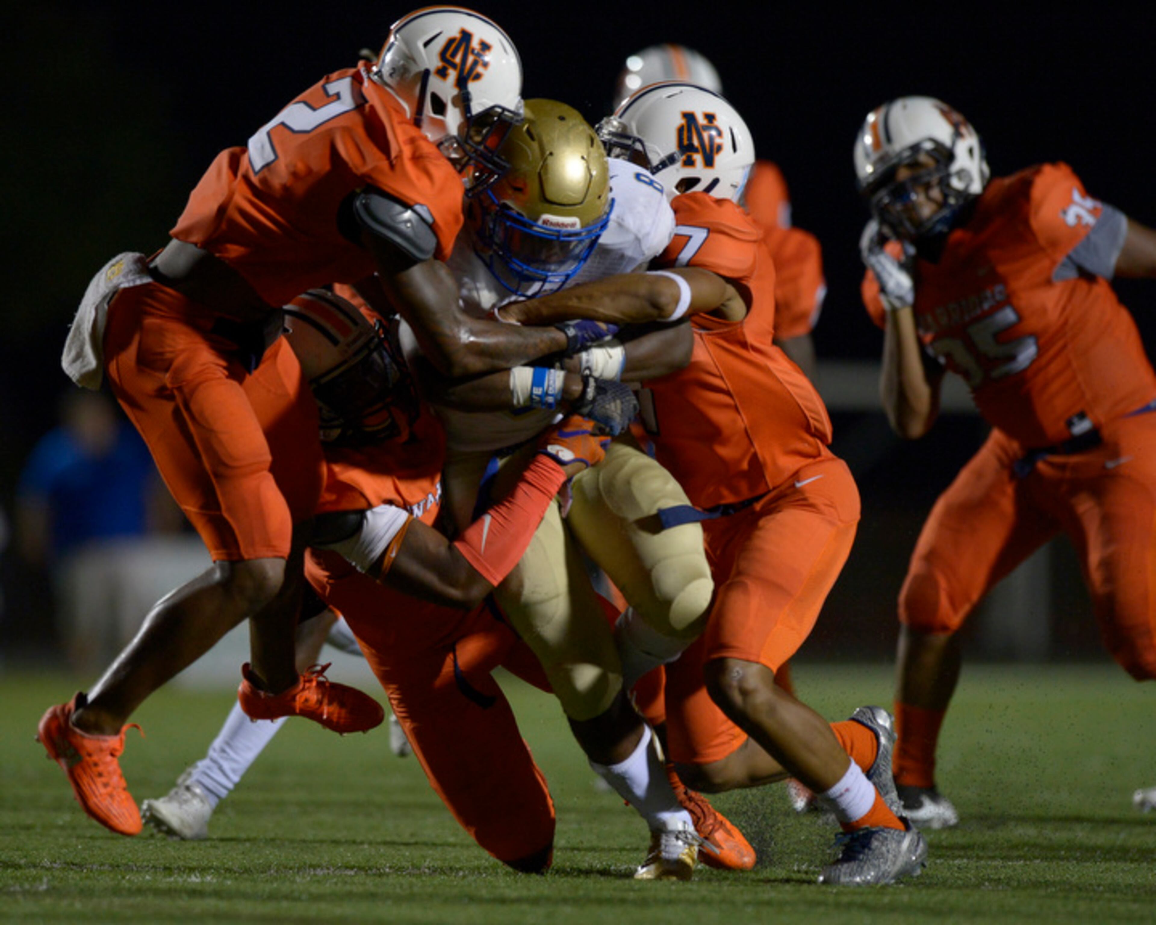 Kennesaw, Ga. -- McEachern junior RB Paris Brown (8) is taken down by North Cobb defenders during the second half of their game at North Cobb Friday, October 6, 2017. Special/Daniel Varnado