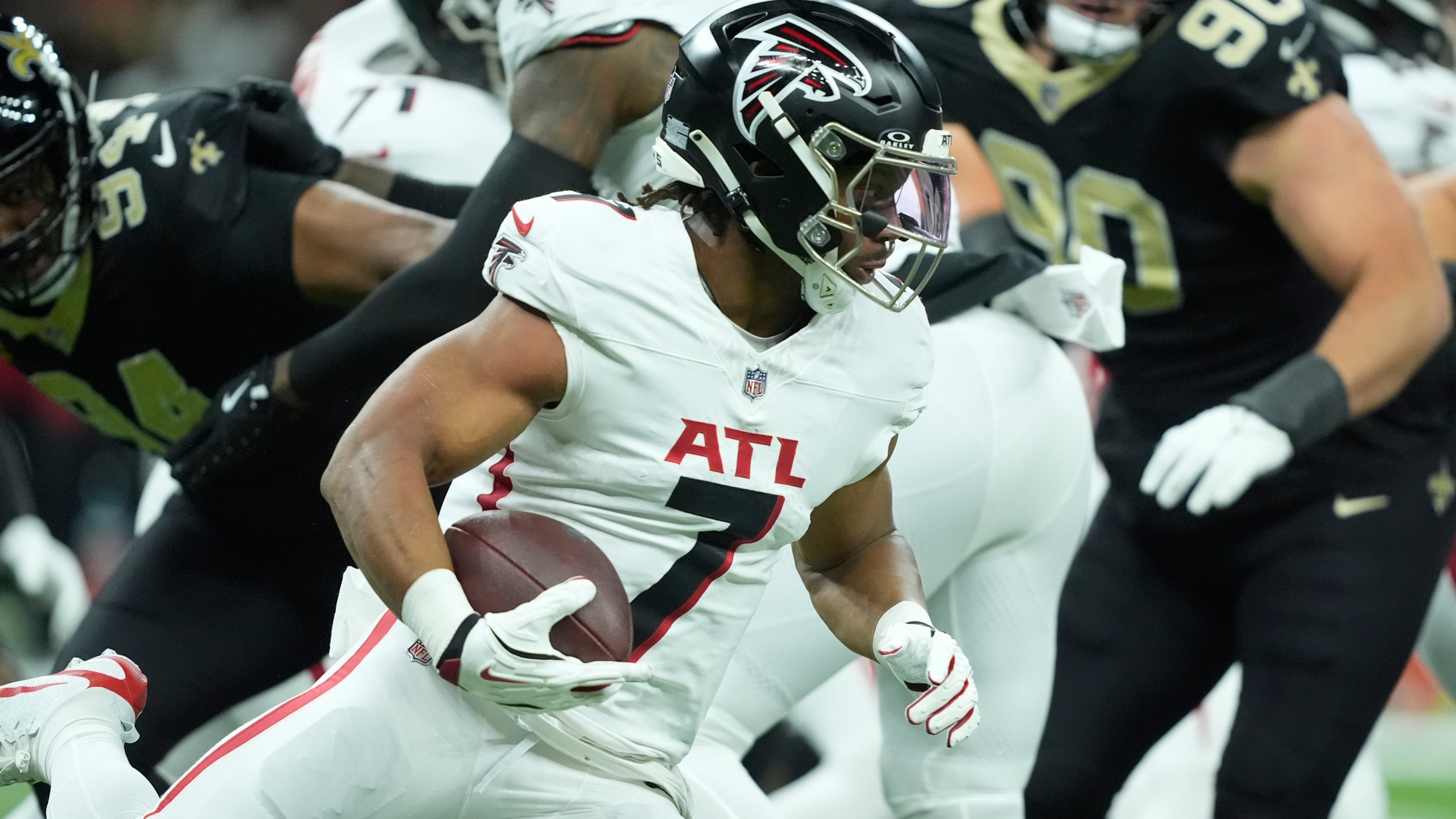 Atlanta Falcons running back Bijan Robinson (7) runs against the New Orleans Saints in the first half of an NFL football game, Sunday, Nov. 23, 2025, in New Orleans. (AP Photo/Gerald Herbert)