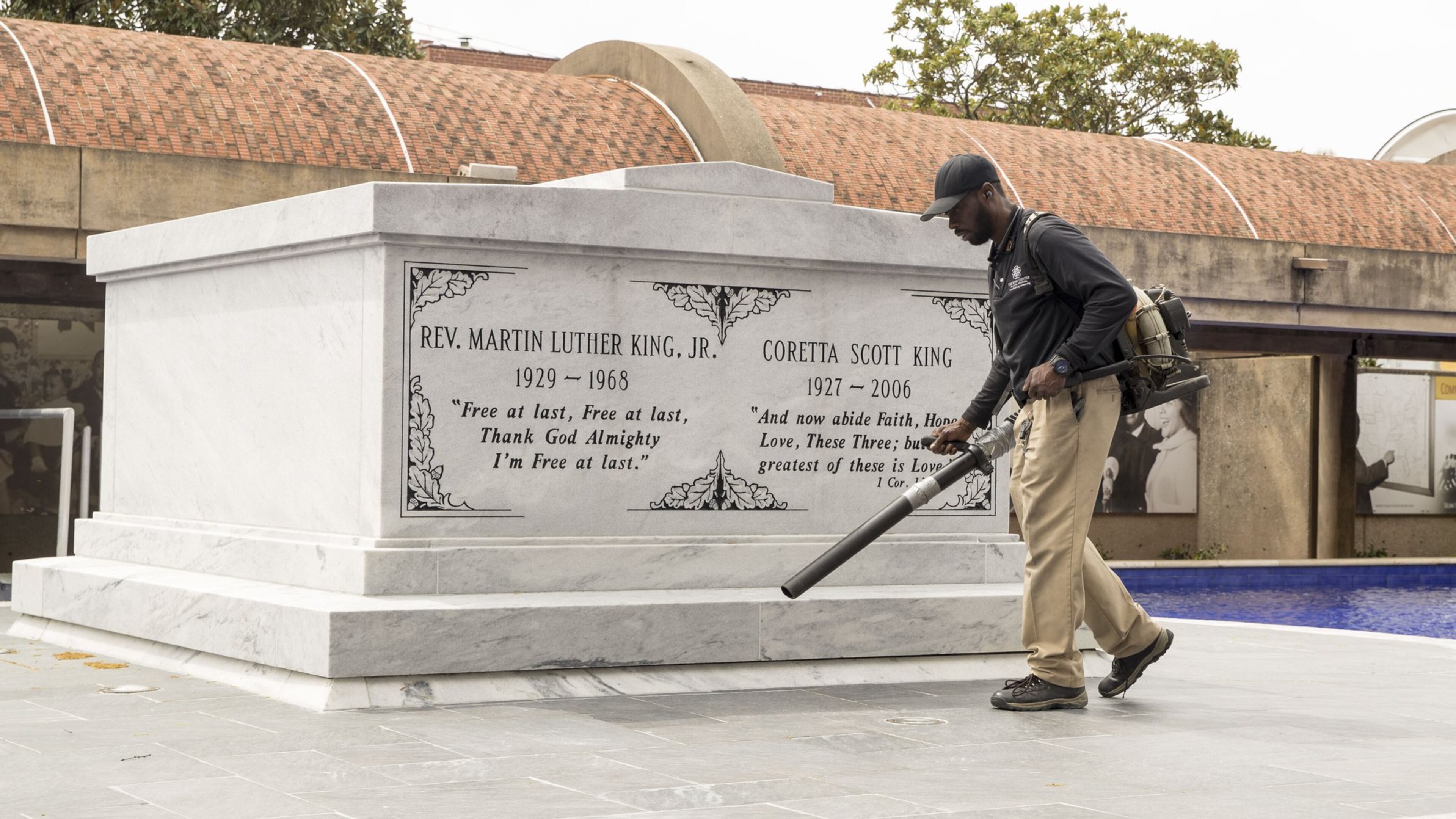 A King Center worker clears debris from the crypt of Martin Luther King Jr. and his wife, Coretta Scott King, at the Martin Luther King Jr. National Historic Park in Atlanta. The King Center and all of Atlanta’s civil right sites are coping with survival in the middle of the coronavirus pandemic ALYSSA POINTER/ALYSSA.POINTER@AJC.COM