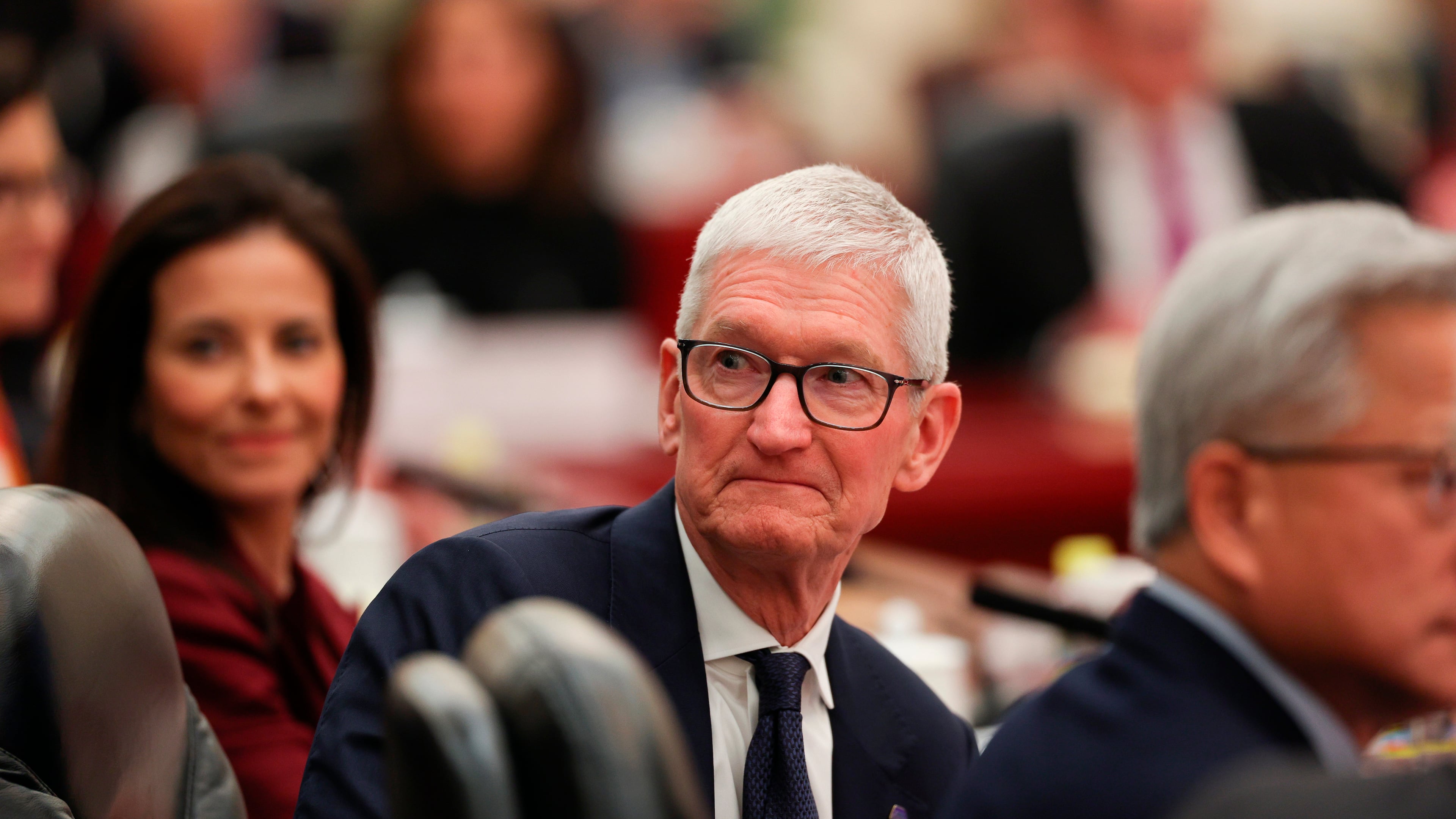 Apple CEO Tim Cook attends a meeting between Chinese Premier Li Qiang and U.S. business representatives, at the Great Hall of the People in Beijing, Thursday, May 14, 2026. (Go Nakamura/Pool Photo via AP)