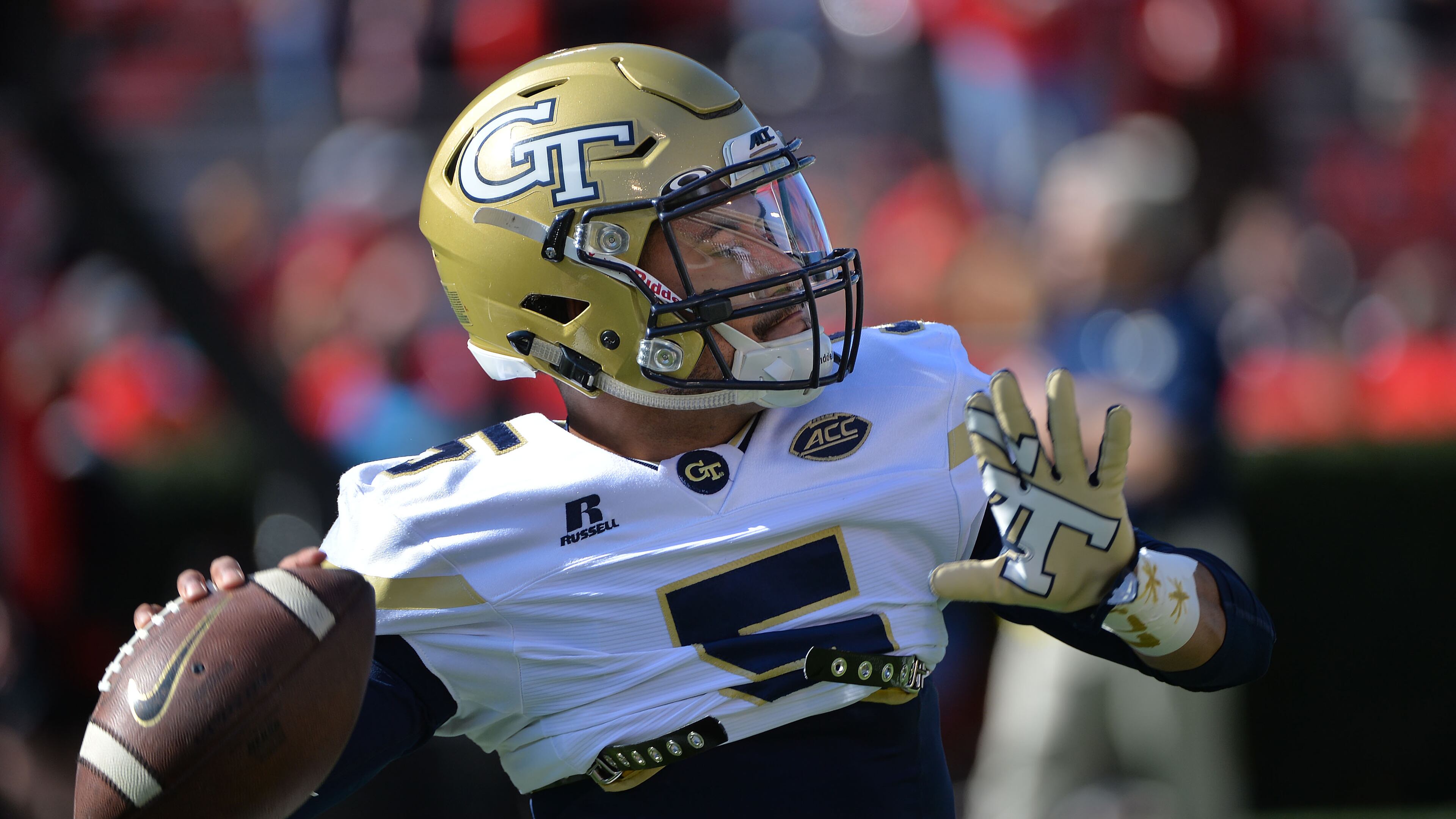 During pregame warm-ups, Georgia Tech quarterback Justin Thomas (5) gets prepared for their rivalry football game against the Georgia at Sanford Stadium on Saturday, November 26, 2016. HYOSUB SHIN / HSHIN@AJC.COM