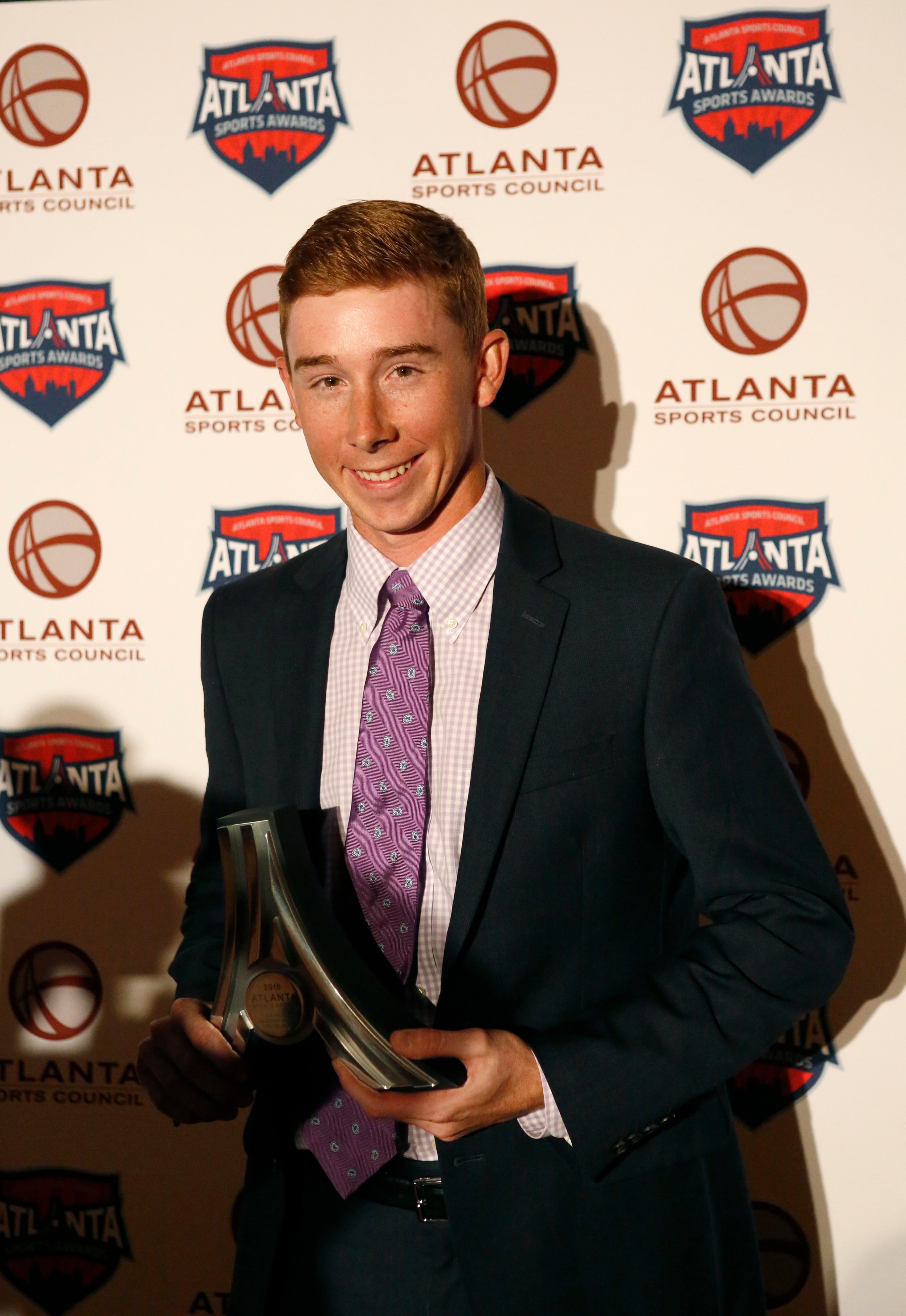 University of Georgia golfer Lee McCoy poses with the Collegiate Athlete of the Year award during the Atlanta Sports Awards at the Fox Theatre Thursday, February 25, 2016, in Atlanta. PHOTO / JASON GETZ
