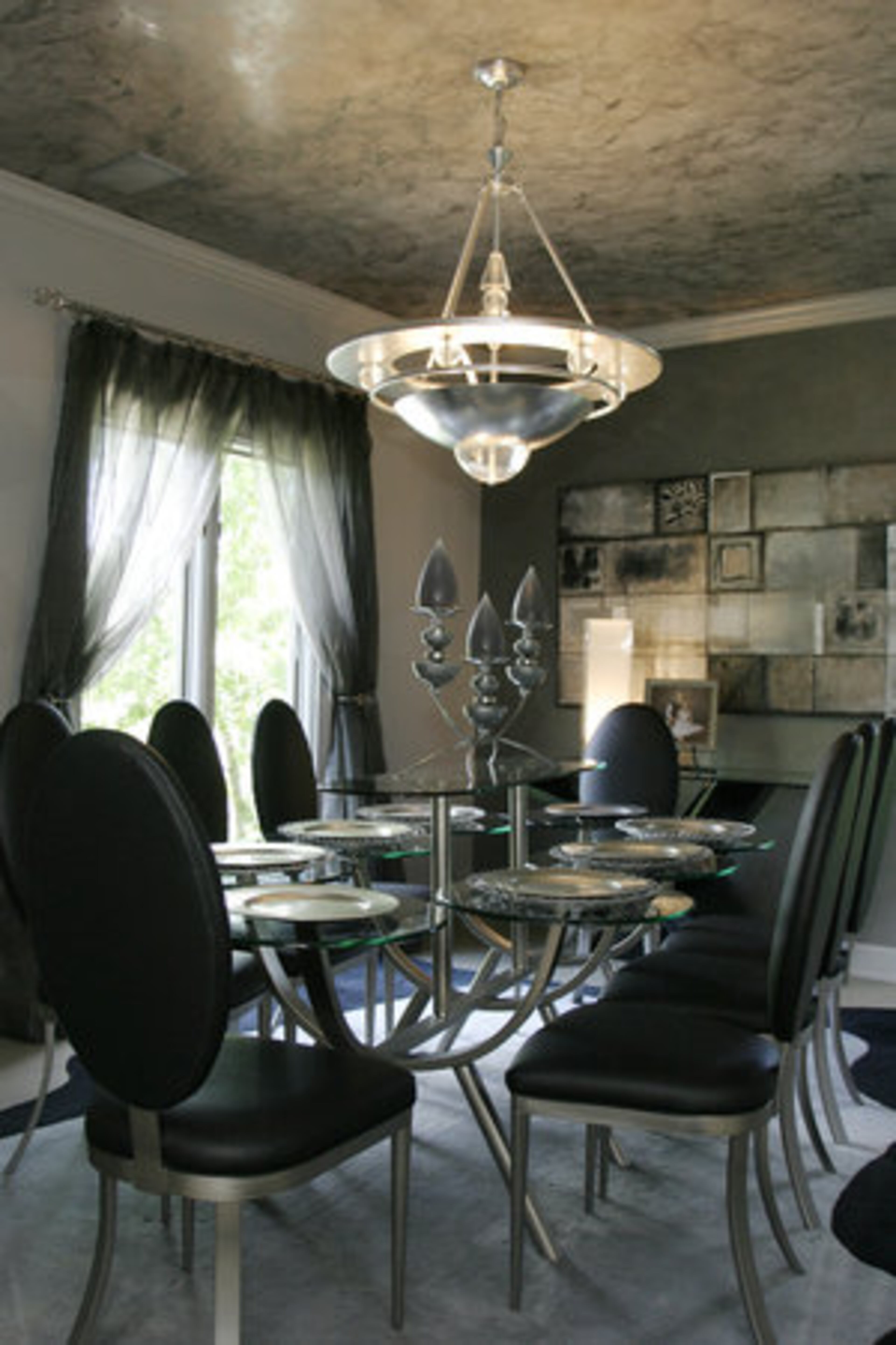 The dining room features a Huff Furniture piece that gives the illusion of multiple small tables.