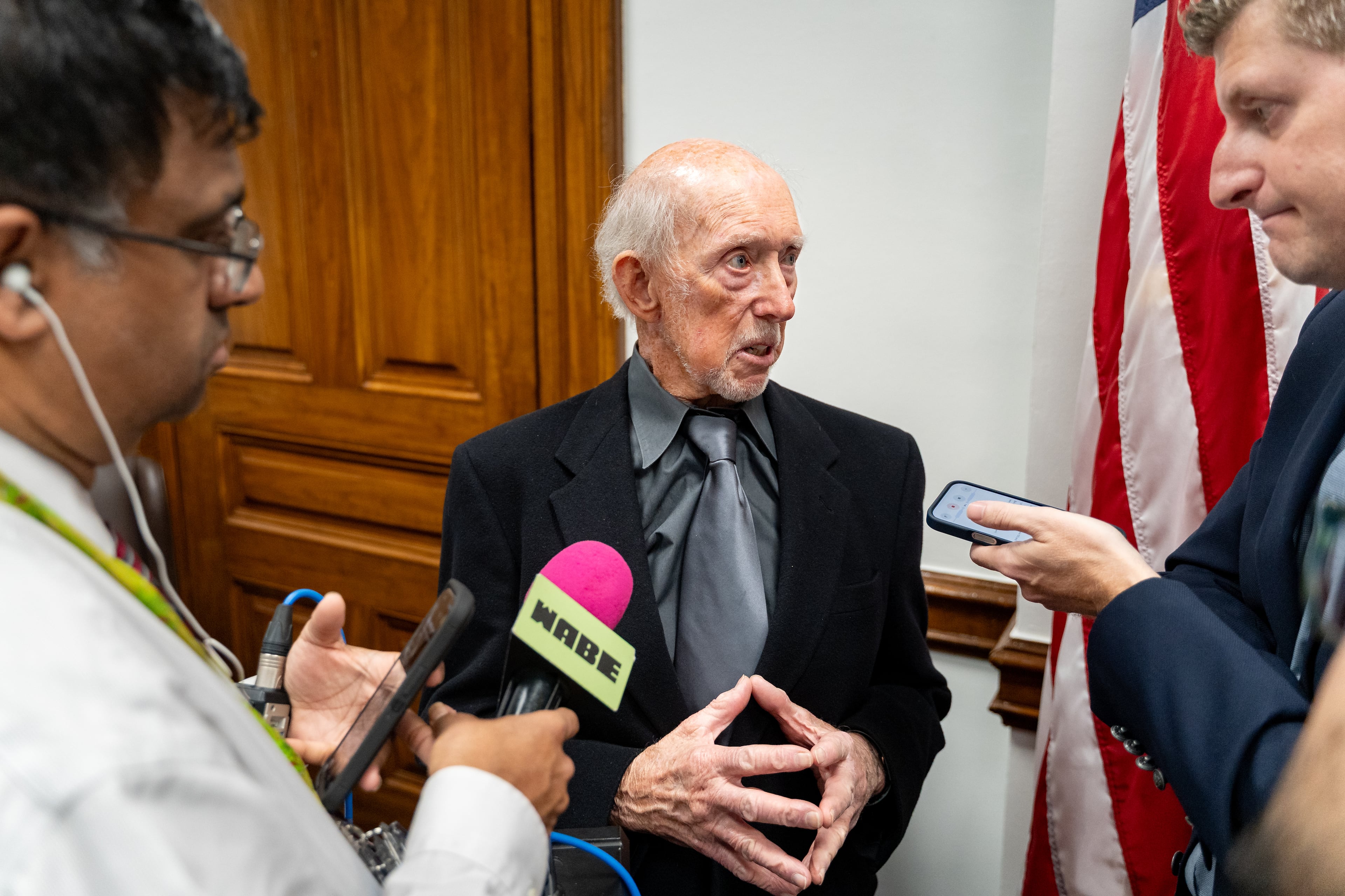 James McMaster, a victim of the First Liberty Building & Loan's alleged Ponzi scheme speaks to the media. Wednesday, Apr 1, 2026. (Ben Hendren for the AJC)