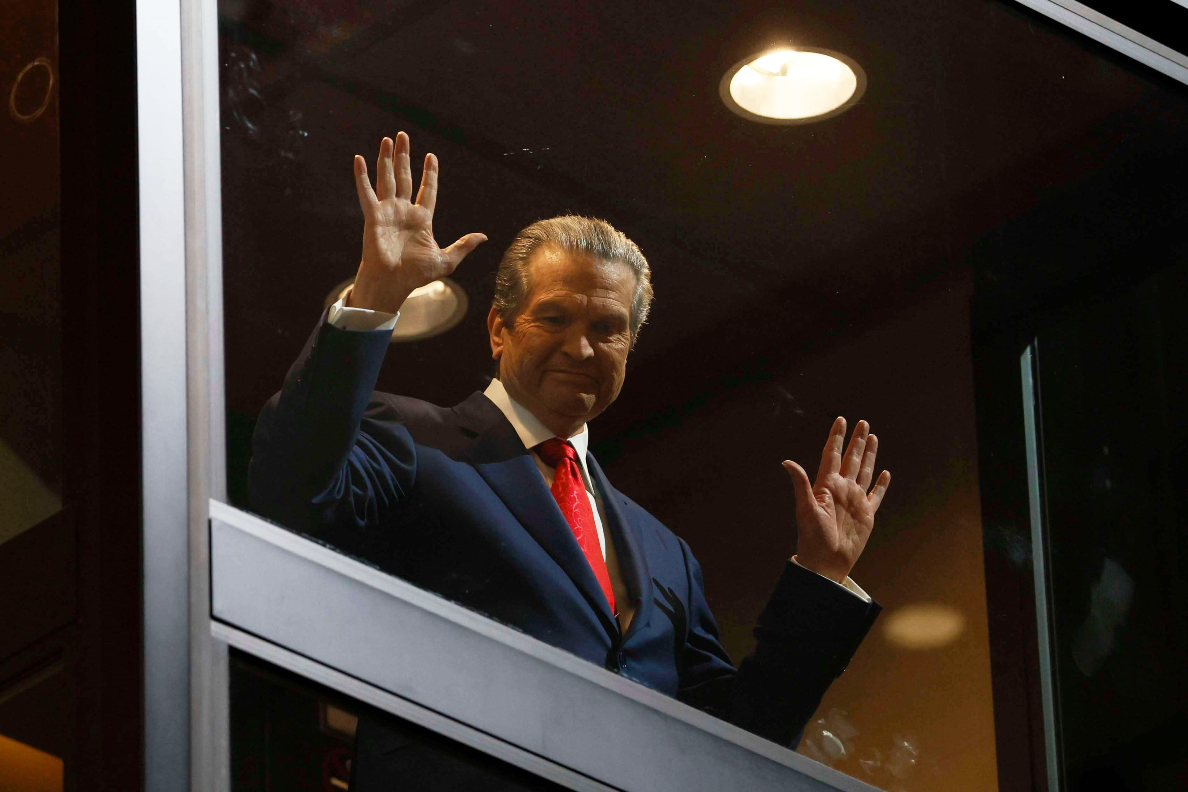 Healthcare business owner Rick Jackson waves to supporters as he comes down in an elevator for his campaign kickoff speech for Georgia governor at Jackson Healthcare, in Alpharetta, Ga., Wednesday, Feb. 4, 2026. (Miguel Martinez/Atlanta Journal-Constitution via AP)
