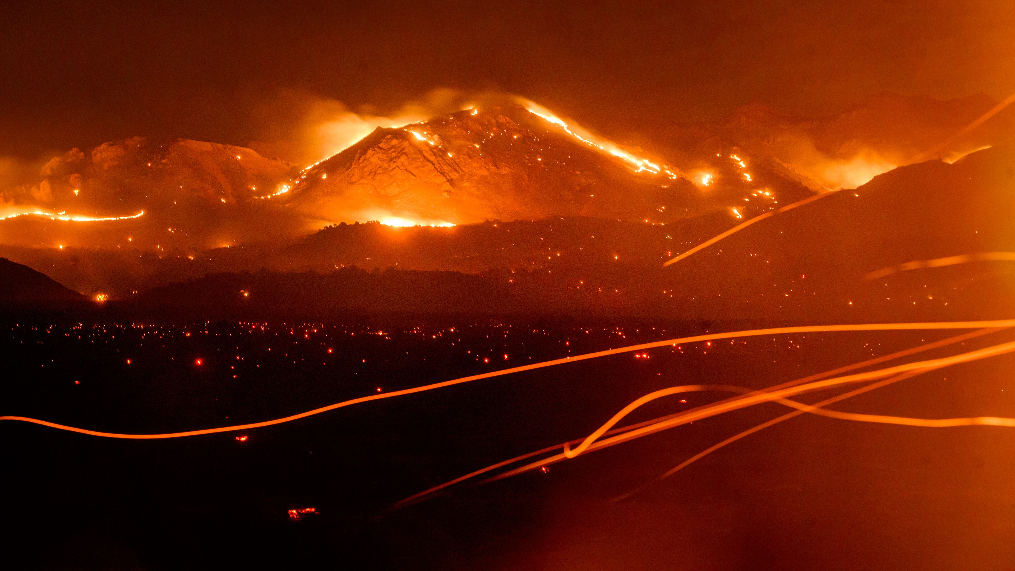 FILE - The Bug Fire burns near Doyle in unincorporated Lassen County, Calif., Aug. 13, 2026. (AP Photo/Noah Berger, File)