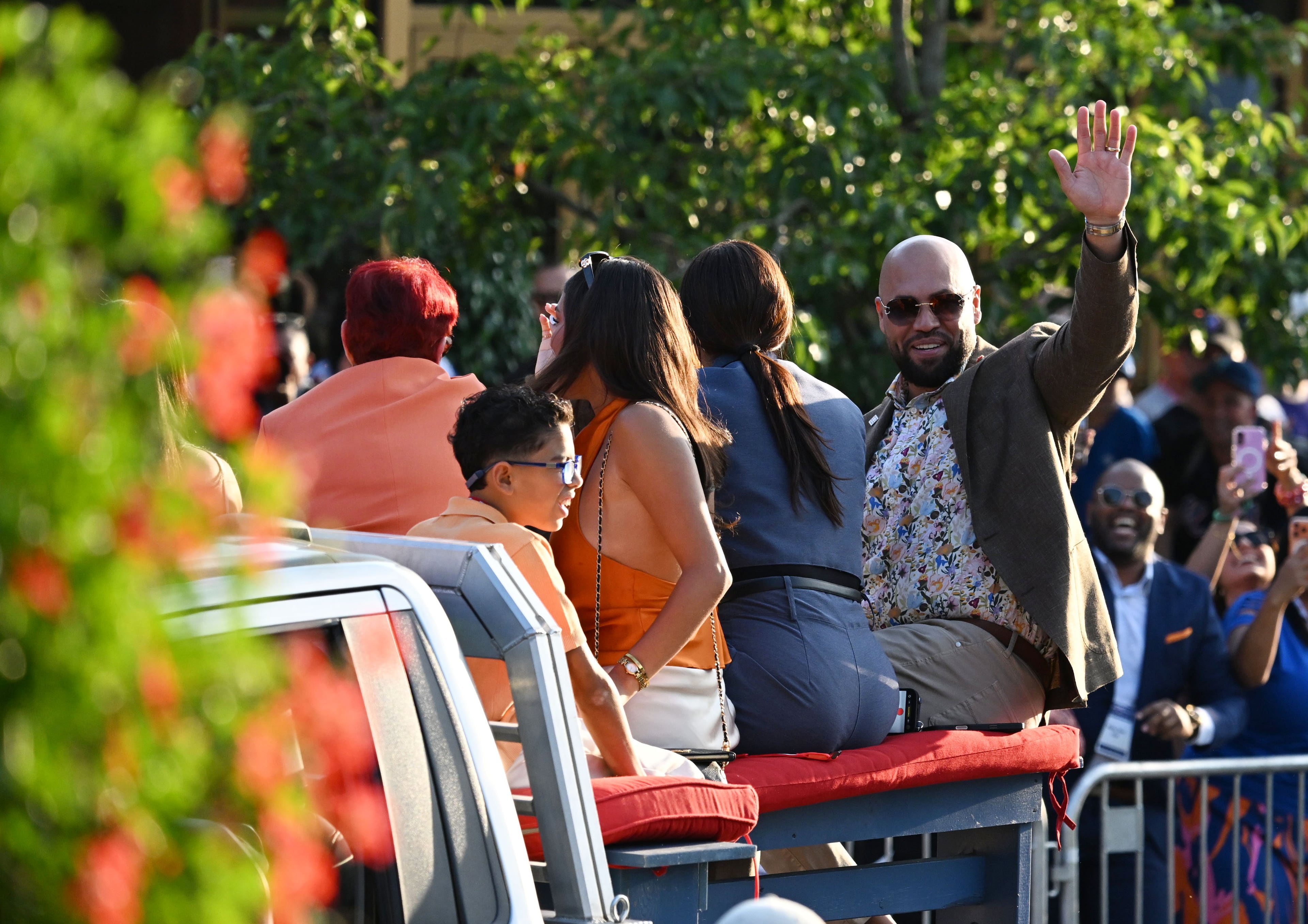 Carlos Beltrán waves to spectators from the back of a pickup truck during the Hall of Fame Legends Parade on Saturday, July 25, 2026, in Cooperstown, N.Y. (Hyosub Shin/AJC)
