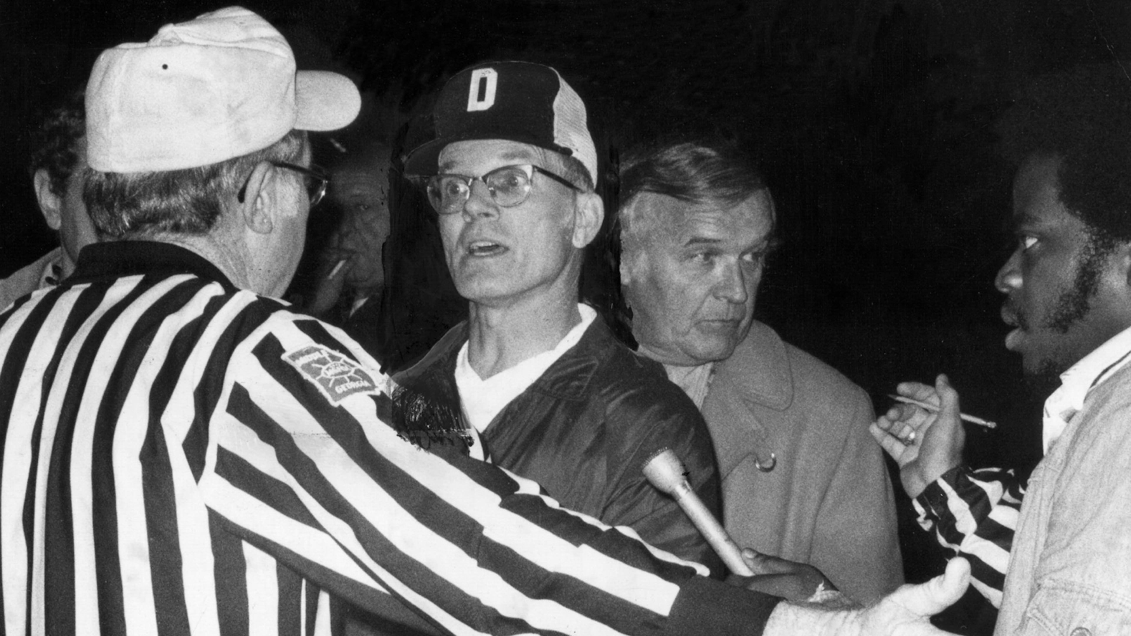 Douglass football coach Charlie Brannon argues with officials in 1975. (AJC file)