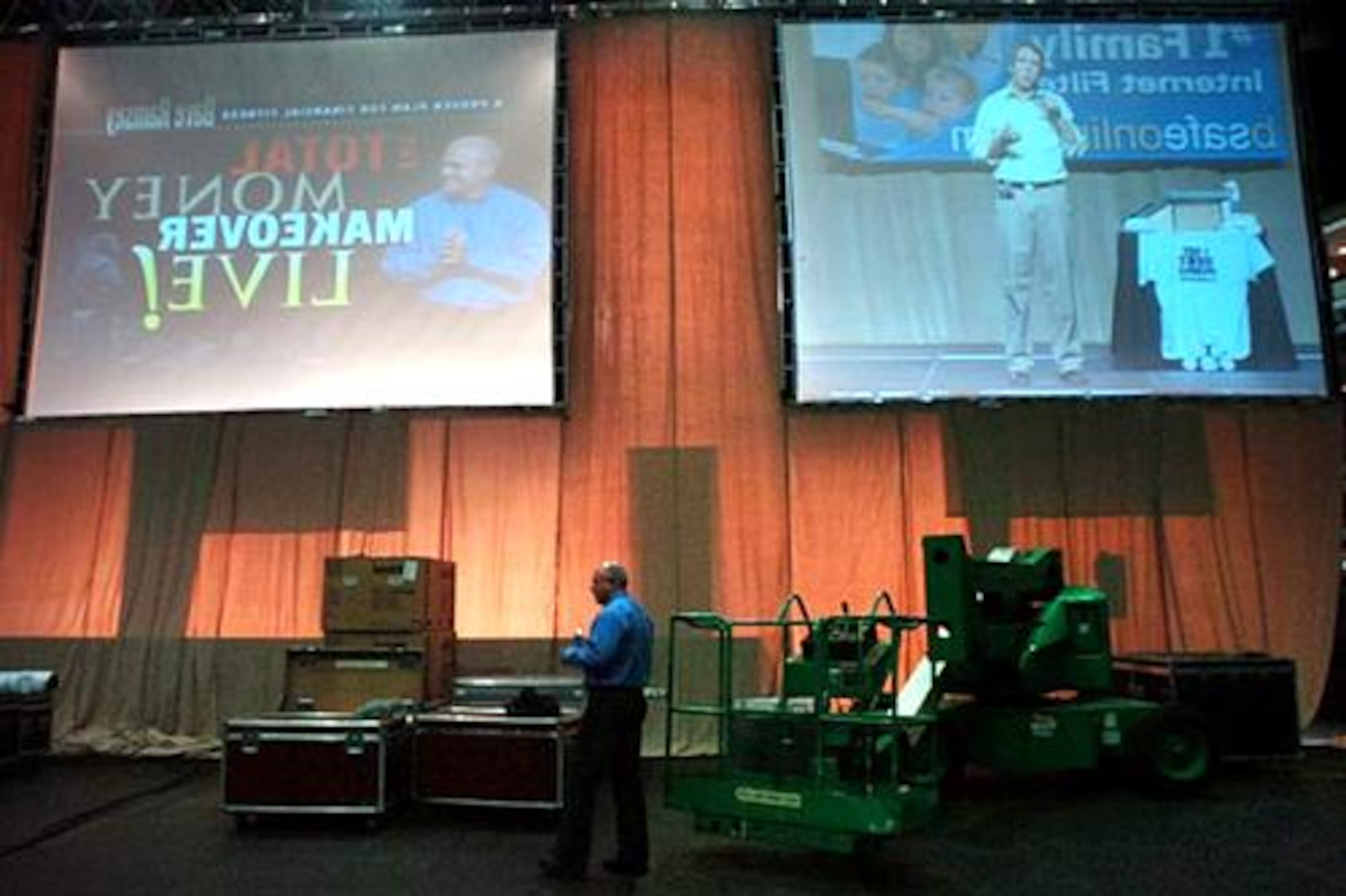 Dave Ramsey paces backstage before his performance at the Gwinnett Arena.