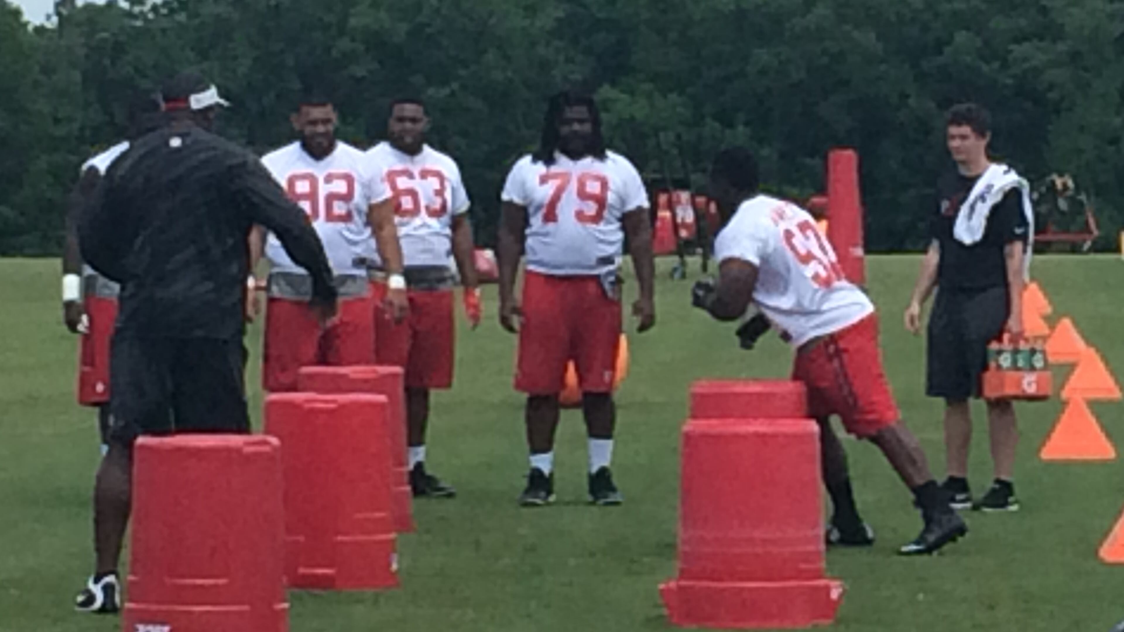 Falcons defensive tackle Grady Jarrett going through the paces under the watchful eye of Bryan Cox. (D. Orlando Ledbetter/DLedbetter@ajc.com)