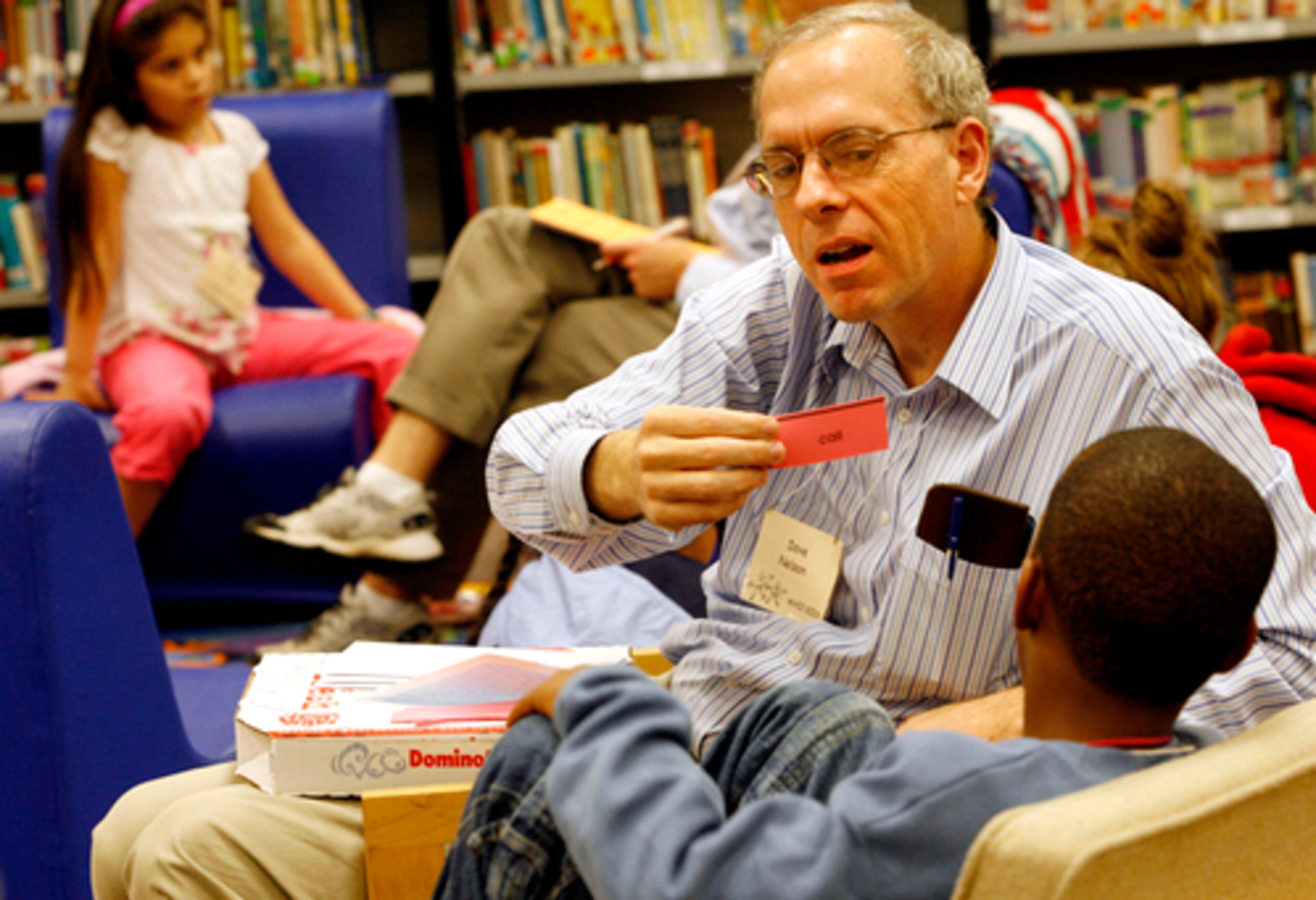 Volunteer Dave Nelson works with Emmanuel Pounds (right) in Mimosa's evening tutoring program.