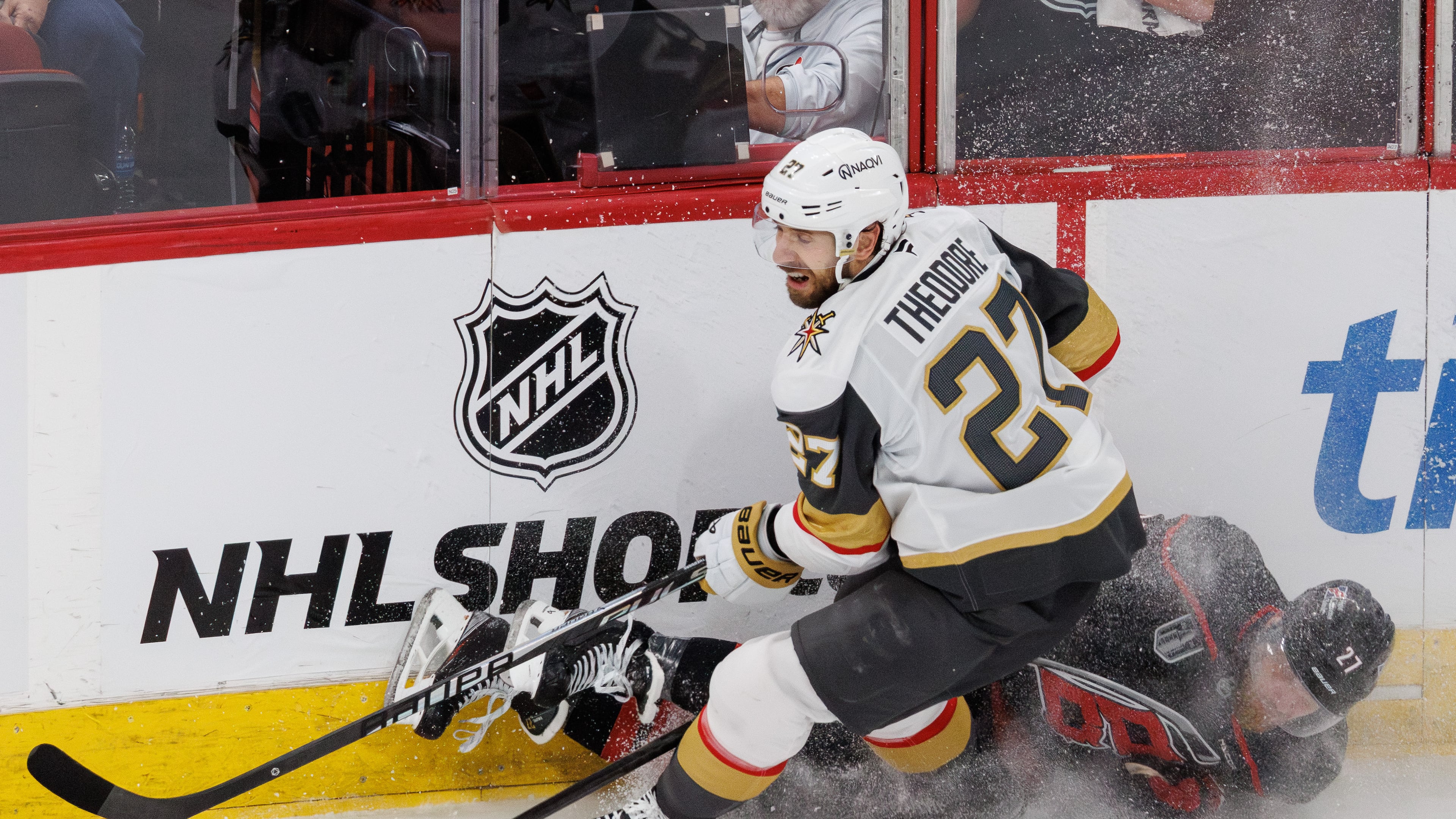 Vegas Golden Knights' Shea Theodore, left, and Carolina Hurricanes' Nikolaj Ehlers, right, collide during the second period in Game 1 of the NHL hockey Stanley Cup Final series in Raleigh, N.C., Tuesday, June 2, 2026. (AP Photo/Ben McKeown)