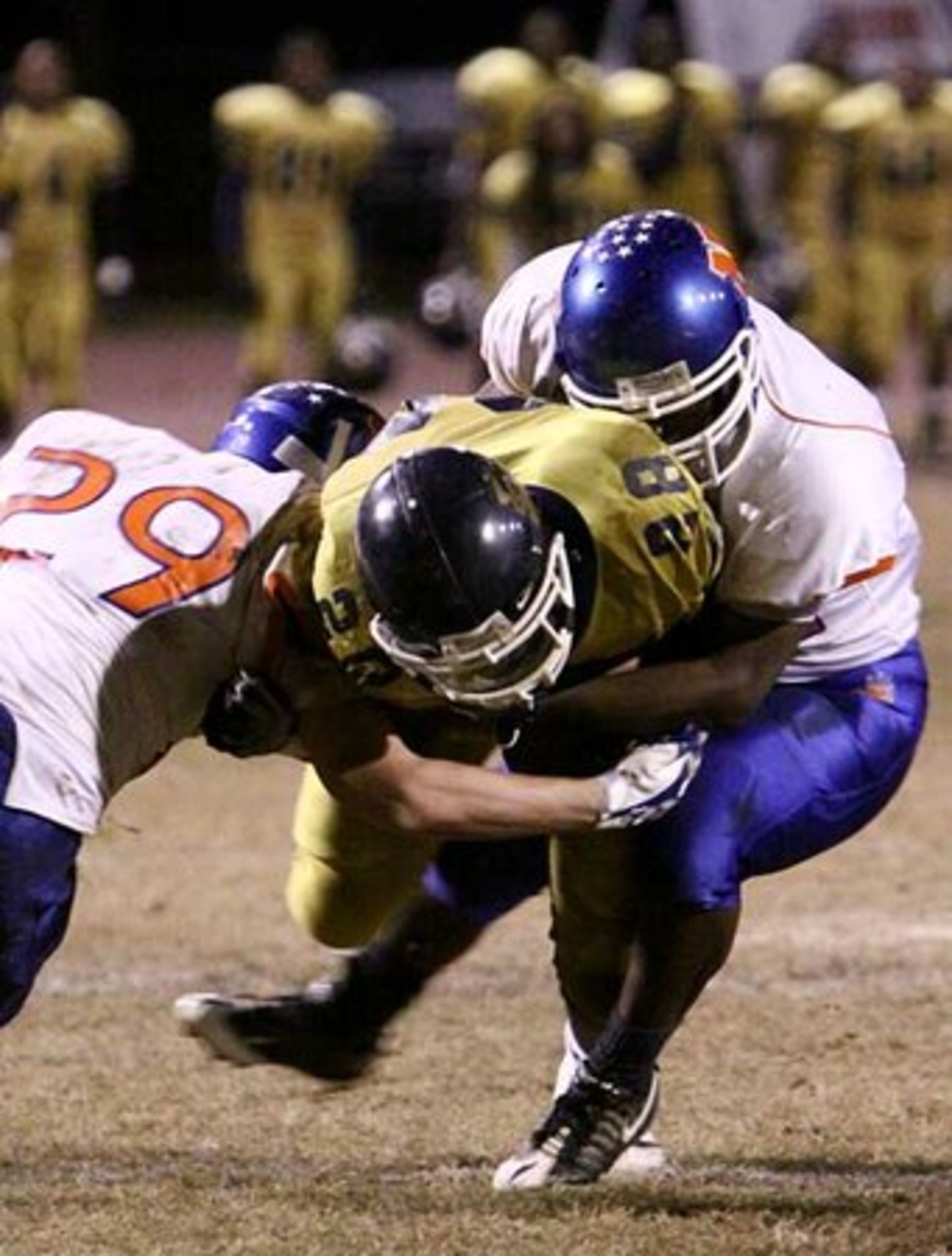 Two Northwest Whitfield defenders engulf running back Andreas Jackson (28) as the Panthers drive to the end zone after a Bruins fumble was recovered by the SW DeKalb defense.