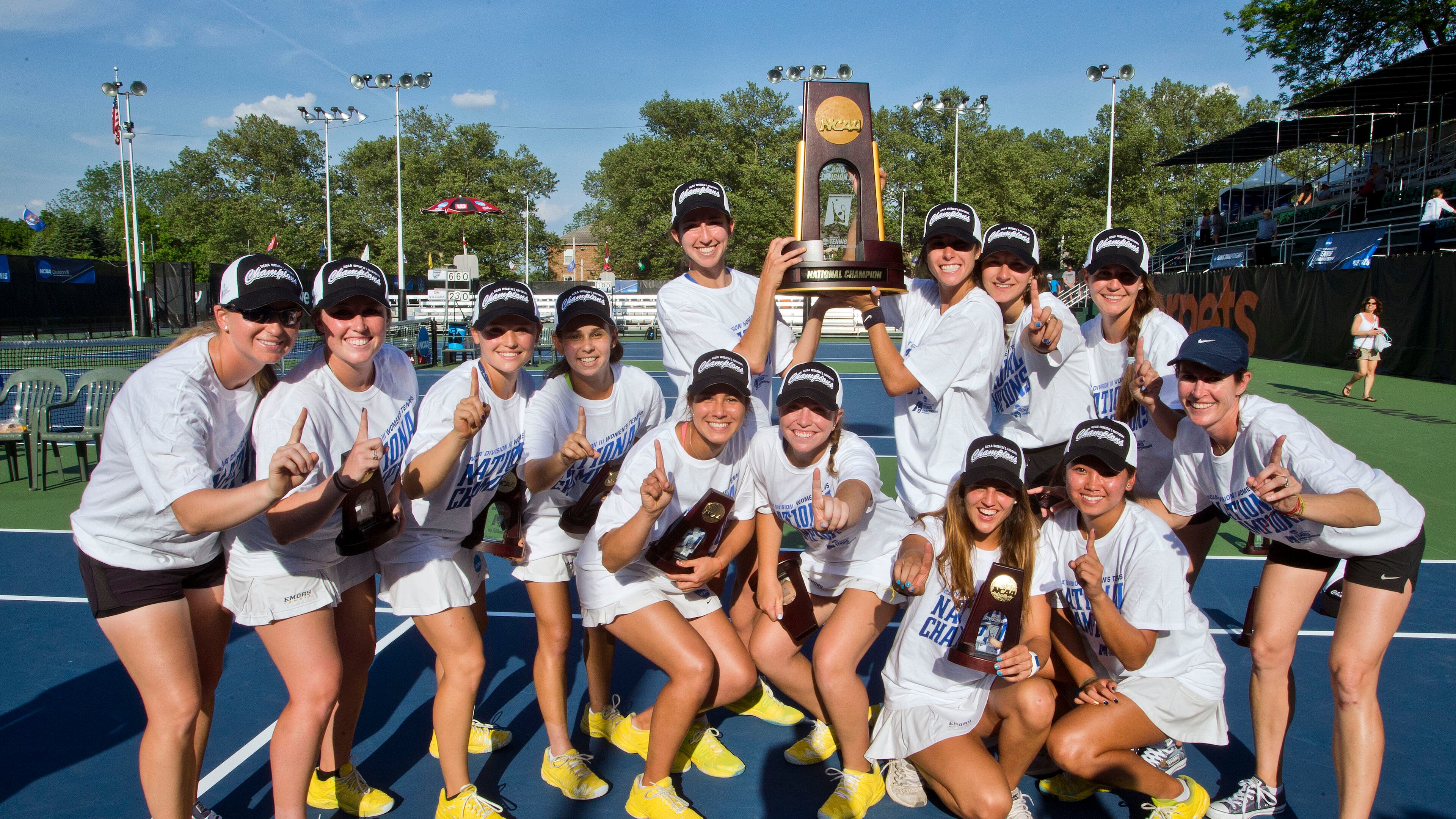Emory University tennis players pose with the trophy after winning the Division III national championship in Kalamazoo, Michigan. Tony Ding/NCAA Photos