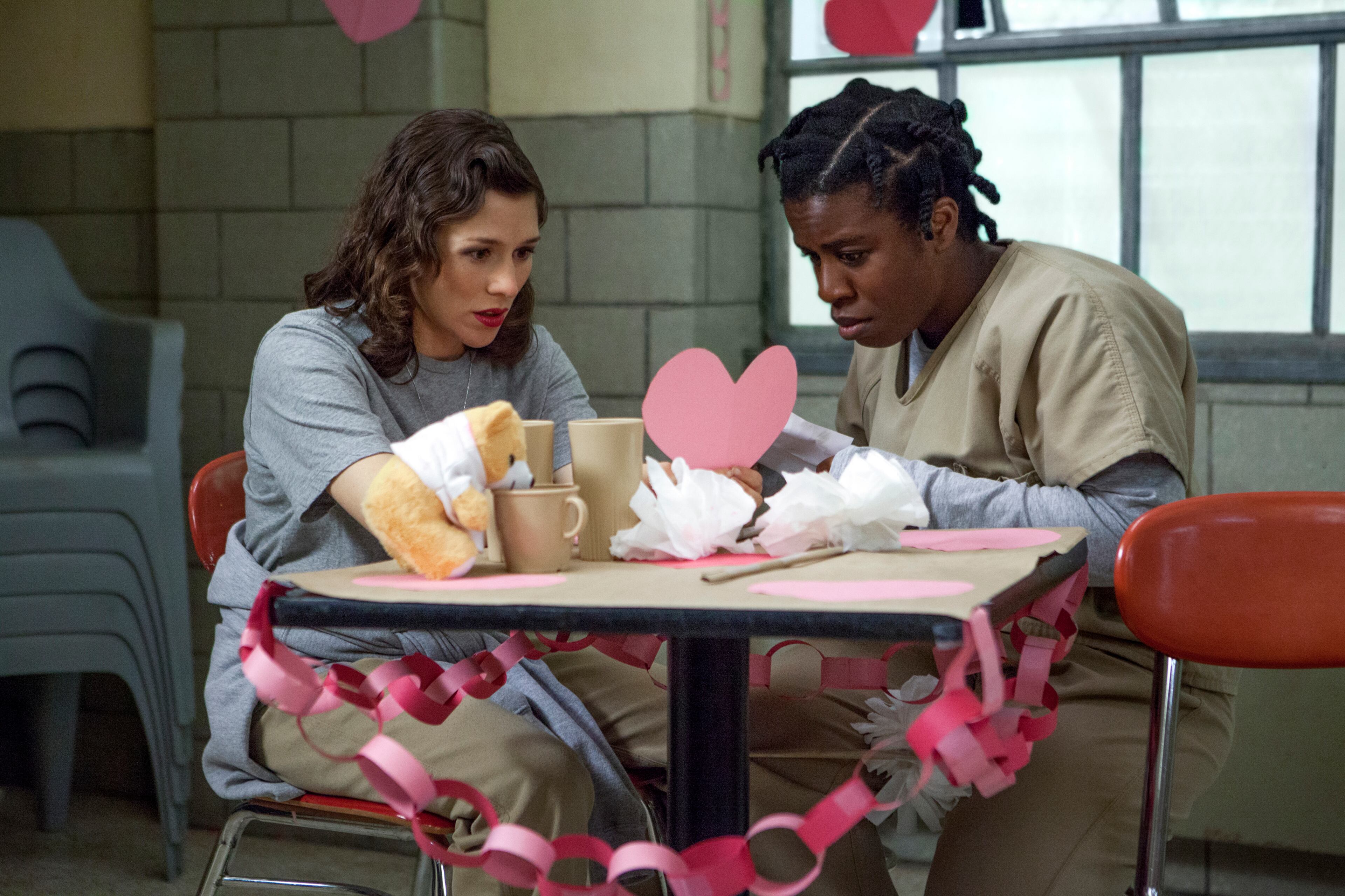 This image released by Netflix shows Yael Stone, left, and Uzo Aduba in a scene from "Orange is the New Black."The second season of the prison series will be available on Friday, June 6, on Netflix. (AP Photo/Netflix, K.C. Bailey)