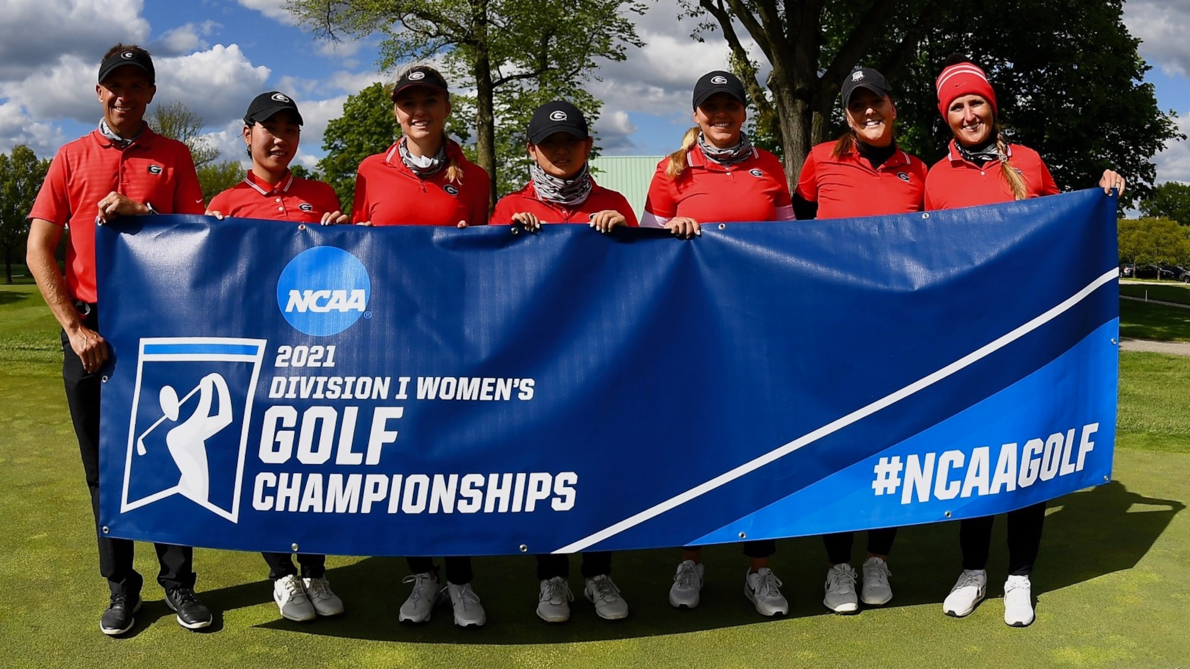 Georgia coach Josh Brewer (L) and members of the Bulldogs' women's golf team pose with the NCAA Columbus Regional banner after blowing away the field over three days win the regional at Ohio State's Scarlett Course to advance to the NCAA Championships next week in Scottsdale, Ariz. (Photo from UGA Athletics)