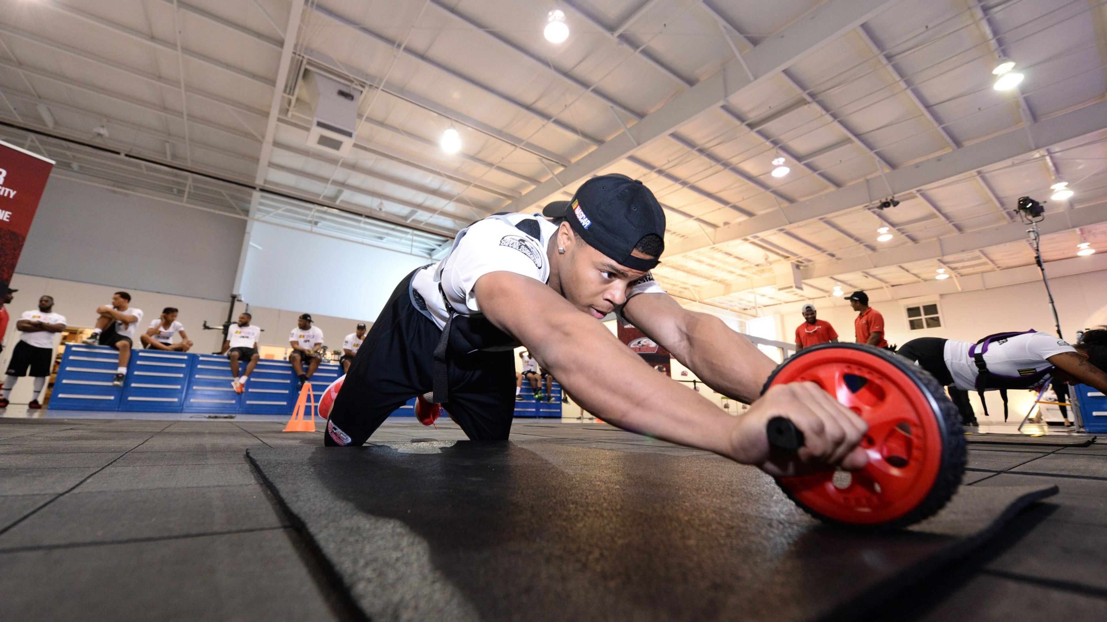Joshua Tate works out at a NASCAR training program for minorities. Being fit is critical to working in the pit crew. CONTRIBUTED