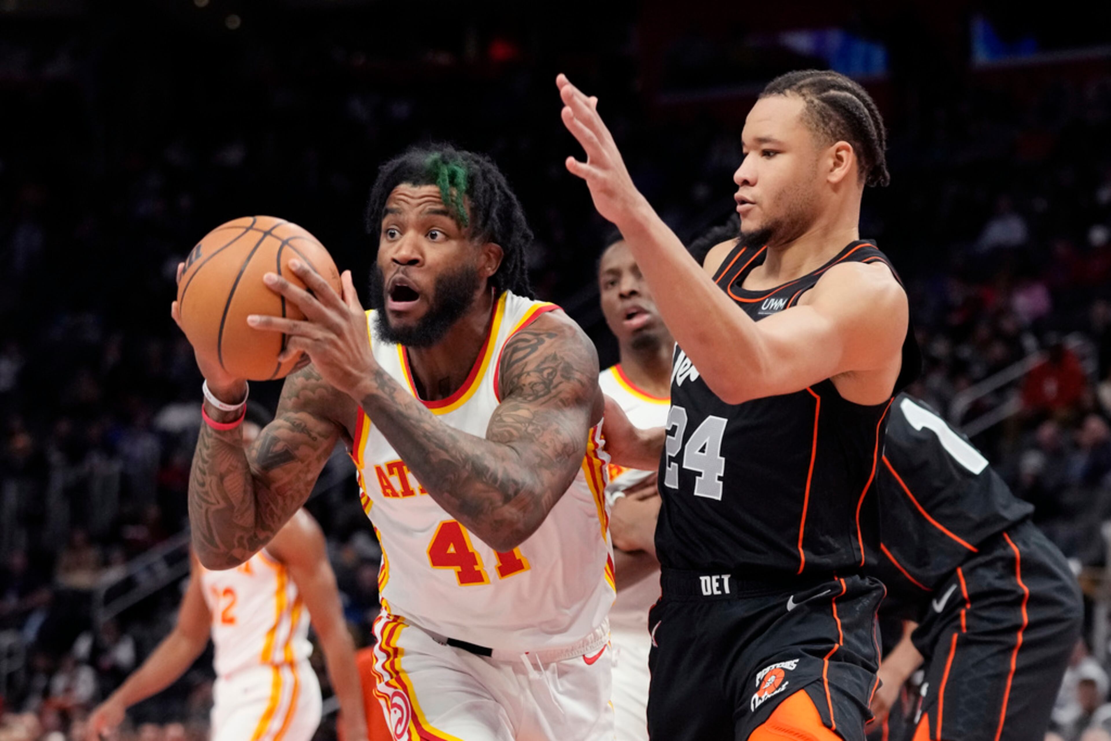 Atlanta Hawks forward Saddiq Bey (41) passes the ball as Detroit Pistons forward Kevin Knox II (24) defends during the first half of an NBA basketball game, Tuesday, Nov. 14, 2023, in Detroit. (AP Photo/Carlos Osorio)