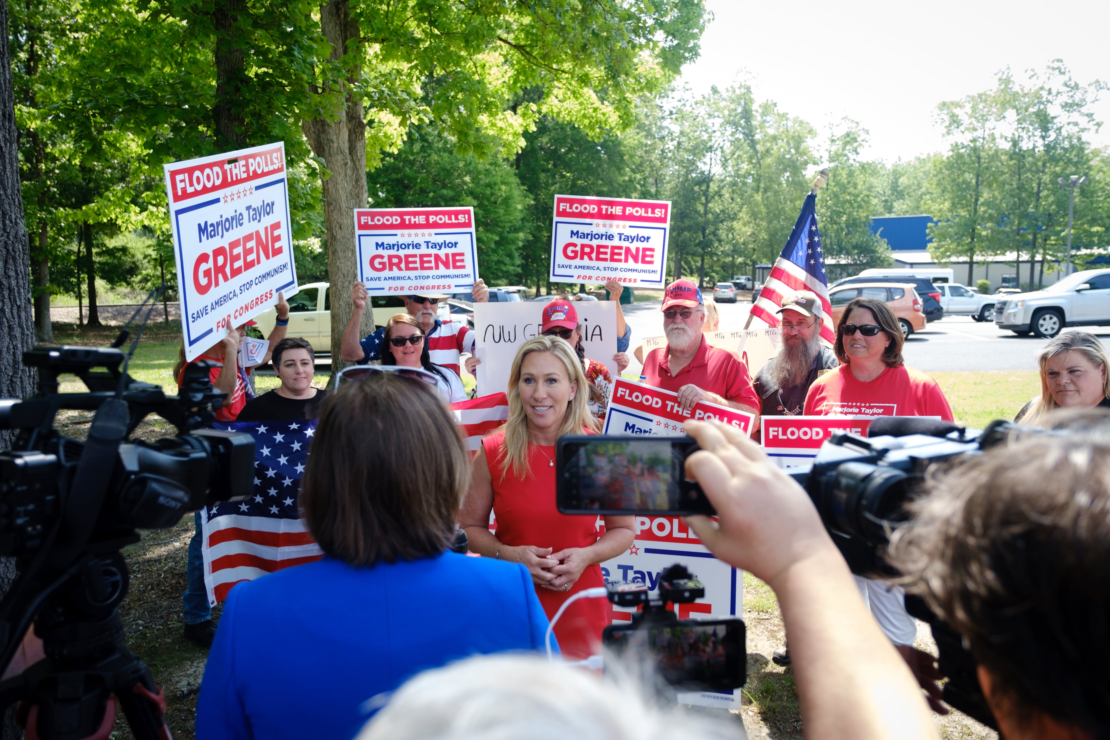 U.S. Rep. Marjorie Taylor Greene speaks to media while campaigning in Rome on Monday, May 2, 2022. (Arvin Temkar / arvin.temkar@ajc.com)